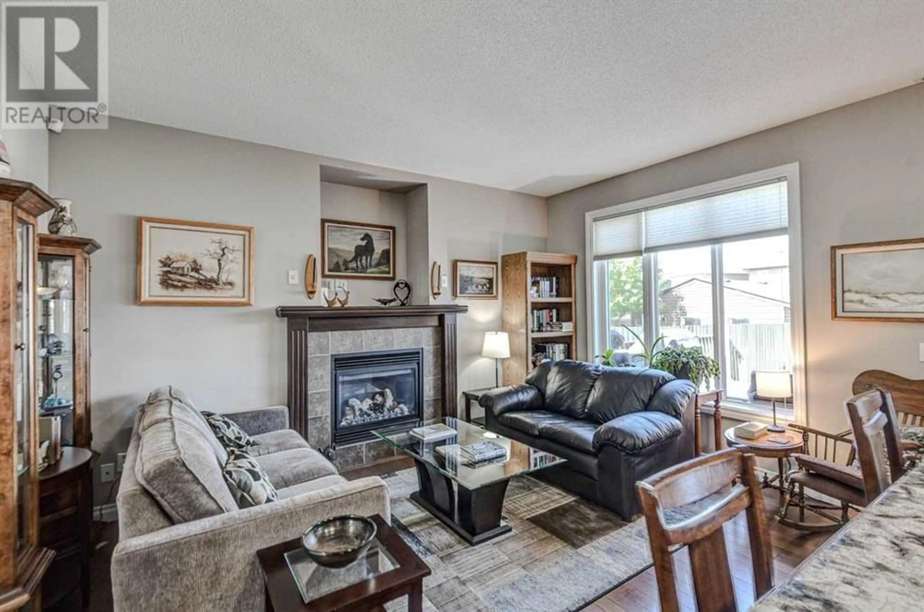 Living room with furniture, unknown for 2497 RAVENSWOOD VIEW SOUTHEAST, Airdrie Alberta T4A0K1