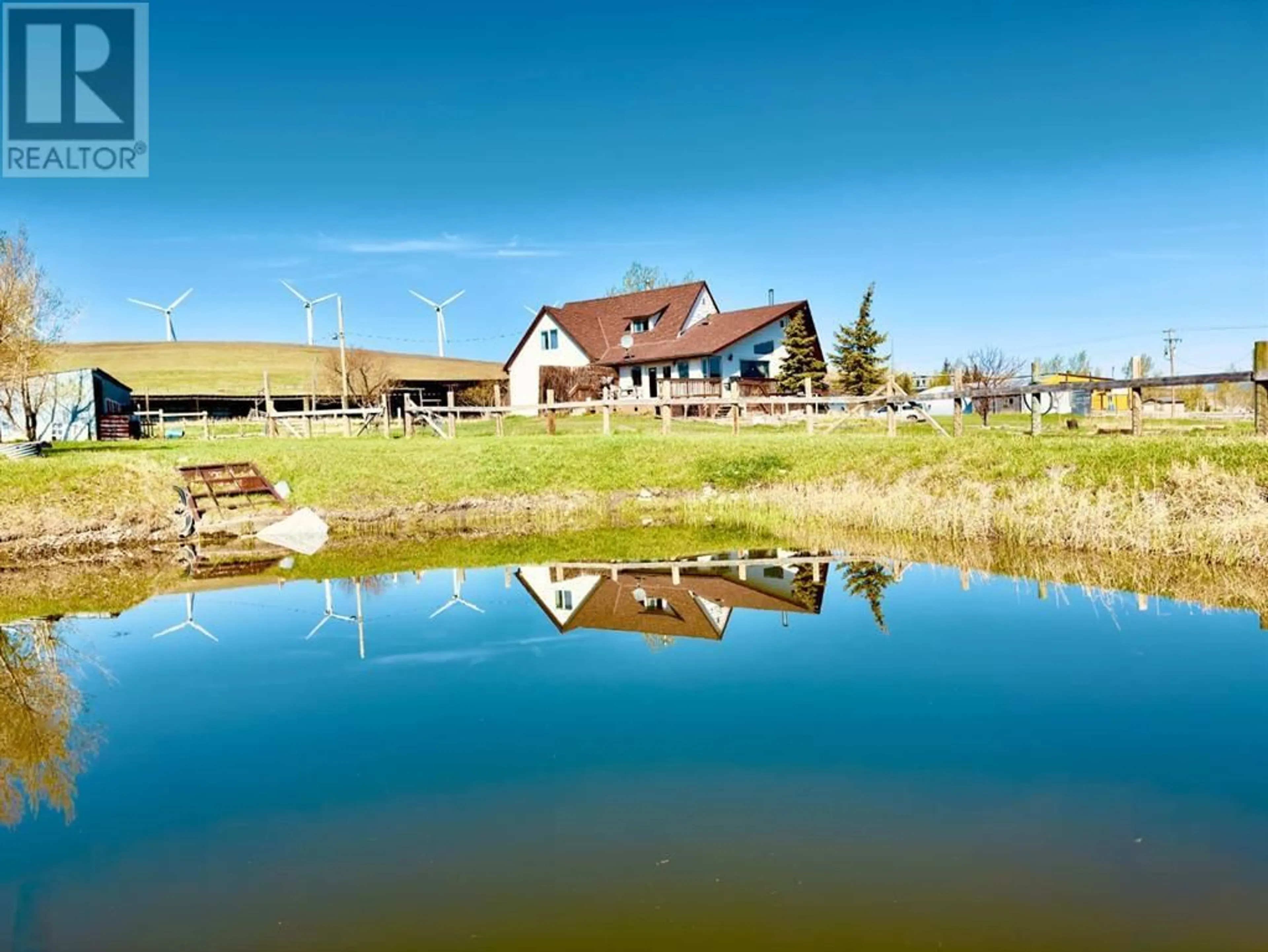 A pic from outside/outdoor area/front of a property/back of a property/a pic from drone, water/lake/river/ocean view for 1411 TWP RD 7-3, Cowley Alberta T0K1W0