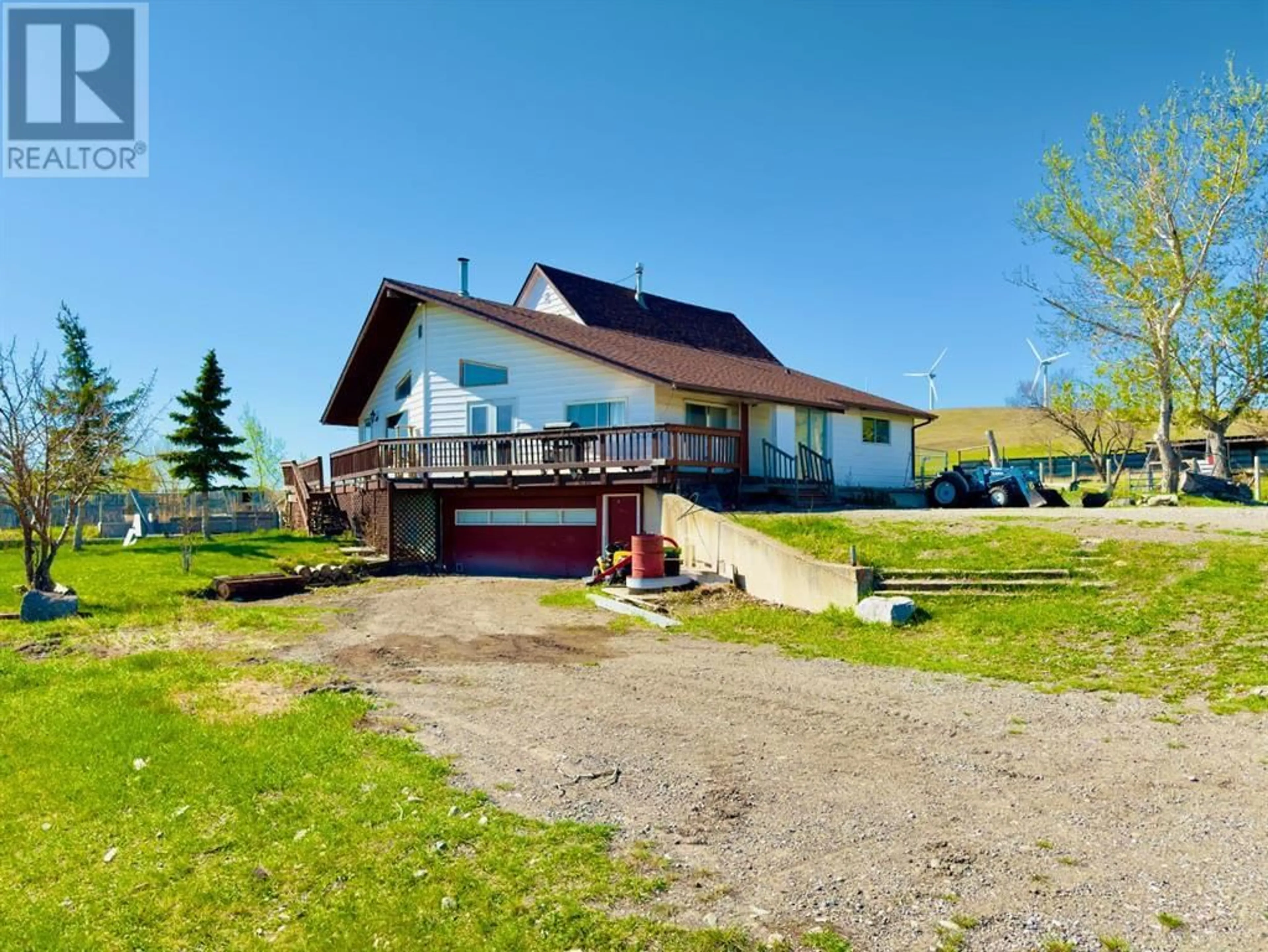 A pic from outside/outdoor area/front of a property/back of a property/a pic from drone, unknown for 1411 TWP RD 7-3, Cowley Alberta T0K1W0