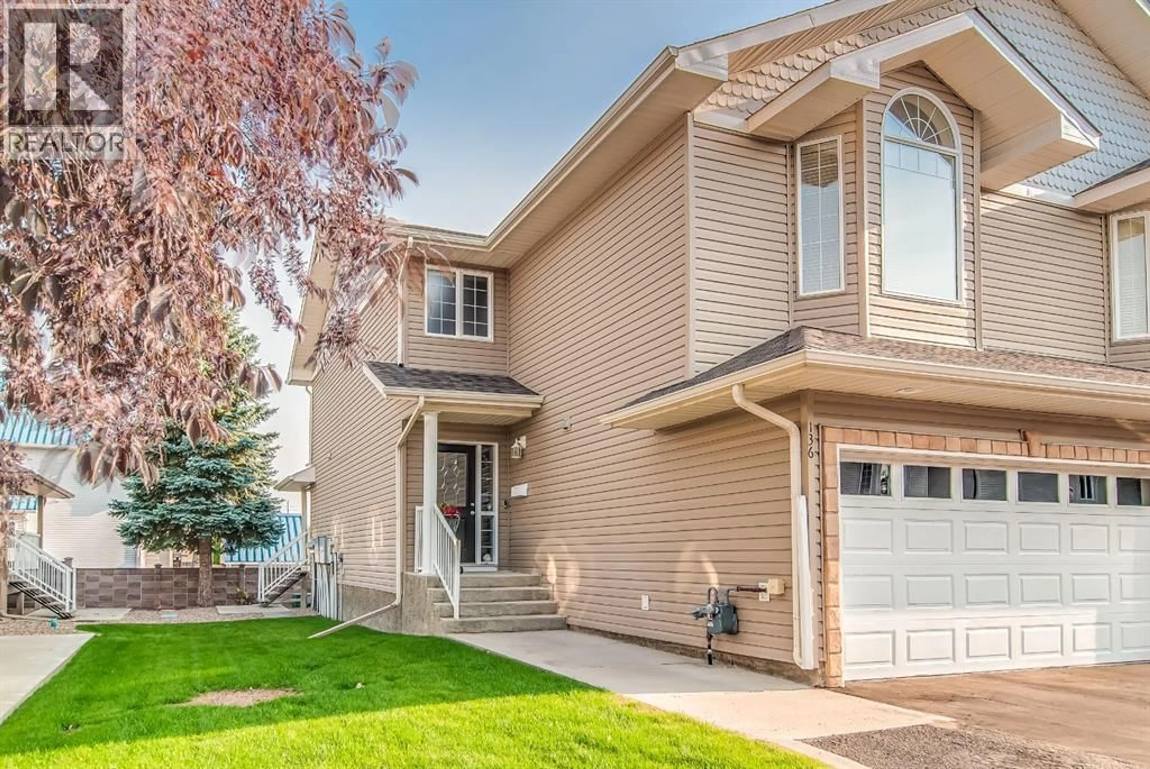 Home with vinyl exterior material, street for 136 PRESTON AVENUE NORTHEAST, Medicine Hat Alberta T1C0E6