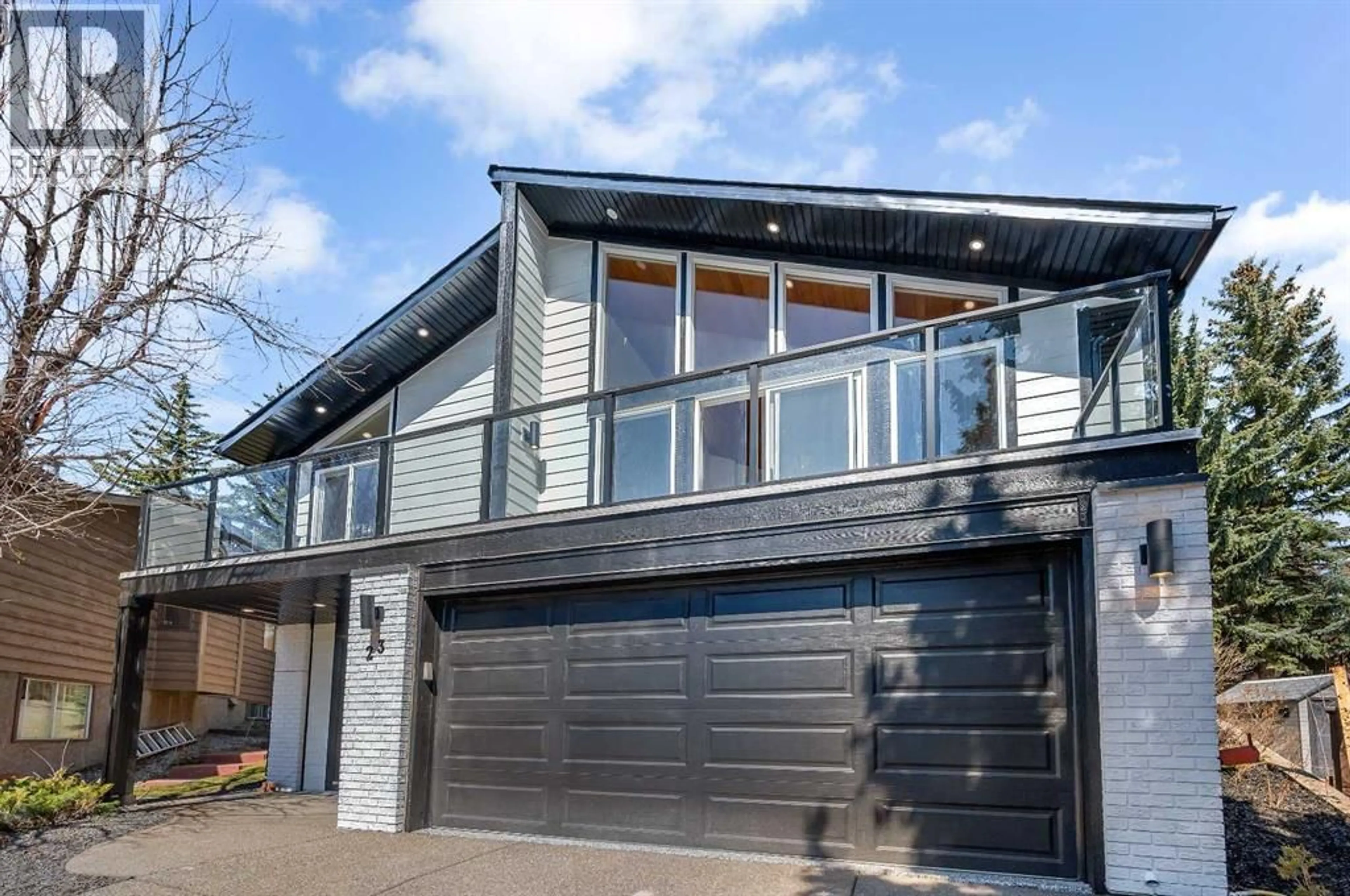Home with vinyl exterior material, street for 23 EDGEWOOD PLACE NORTHWEST, Calgary Alberta T3A2T8