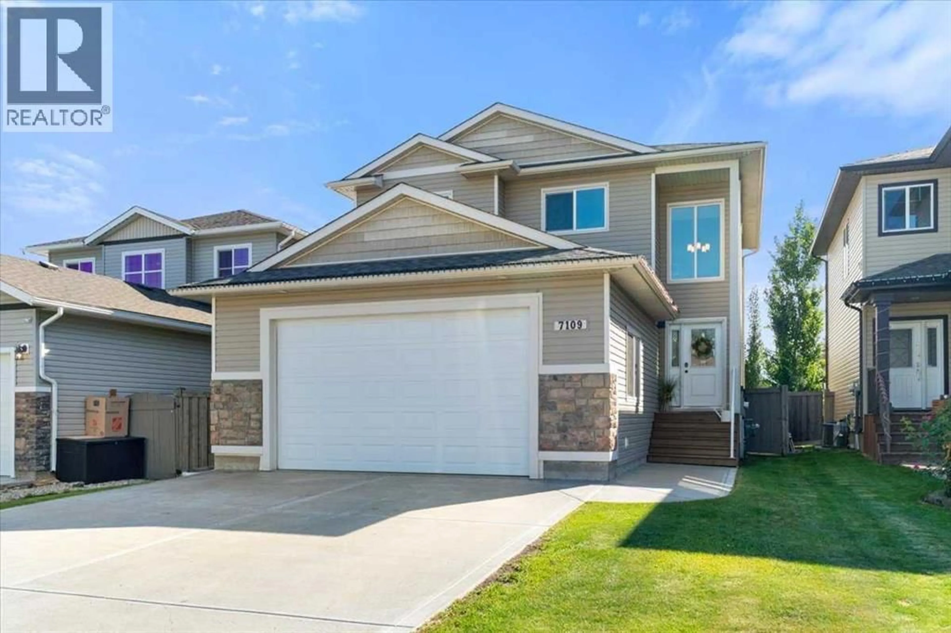 Home with vinyl exterior material, street for 7109 87B STREET, Grande Prairie Alberta T8X0K5