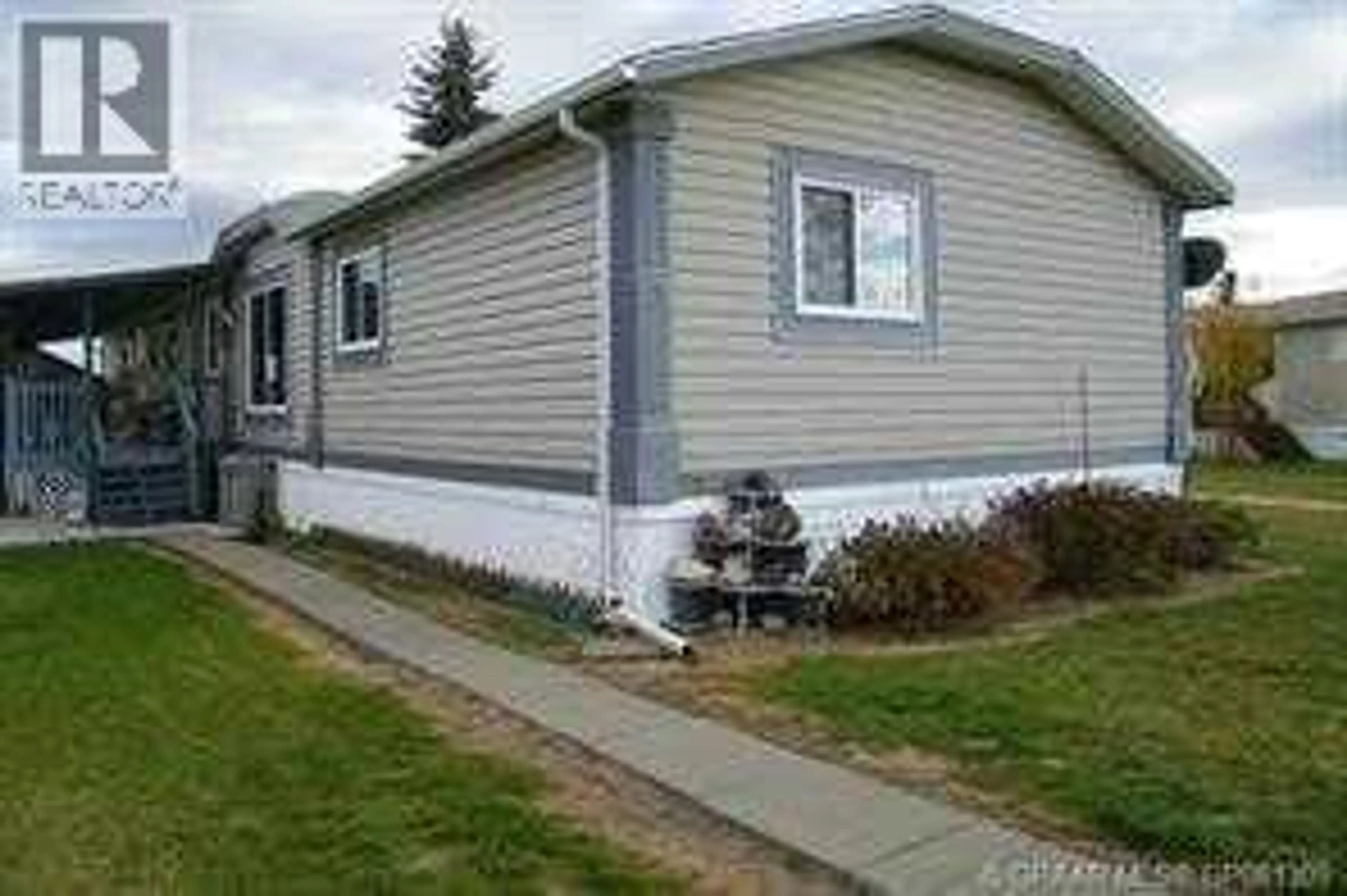 Home with vinyl exterior material, street for 7928 97 AVENUE, Peace River Alberta T8S1W6