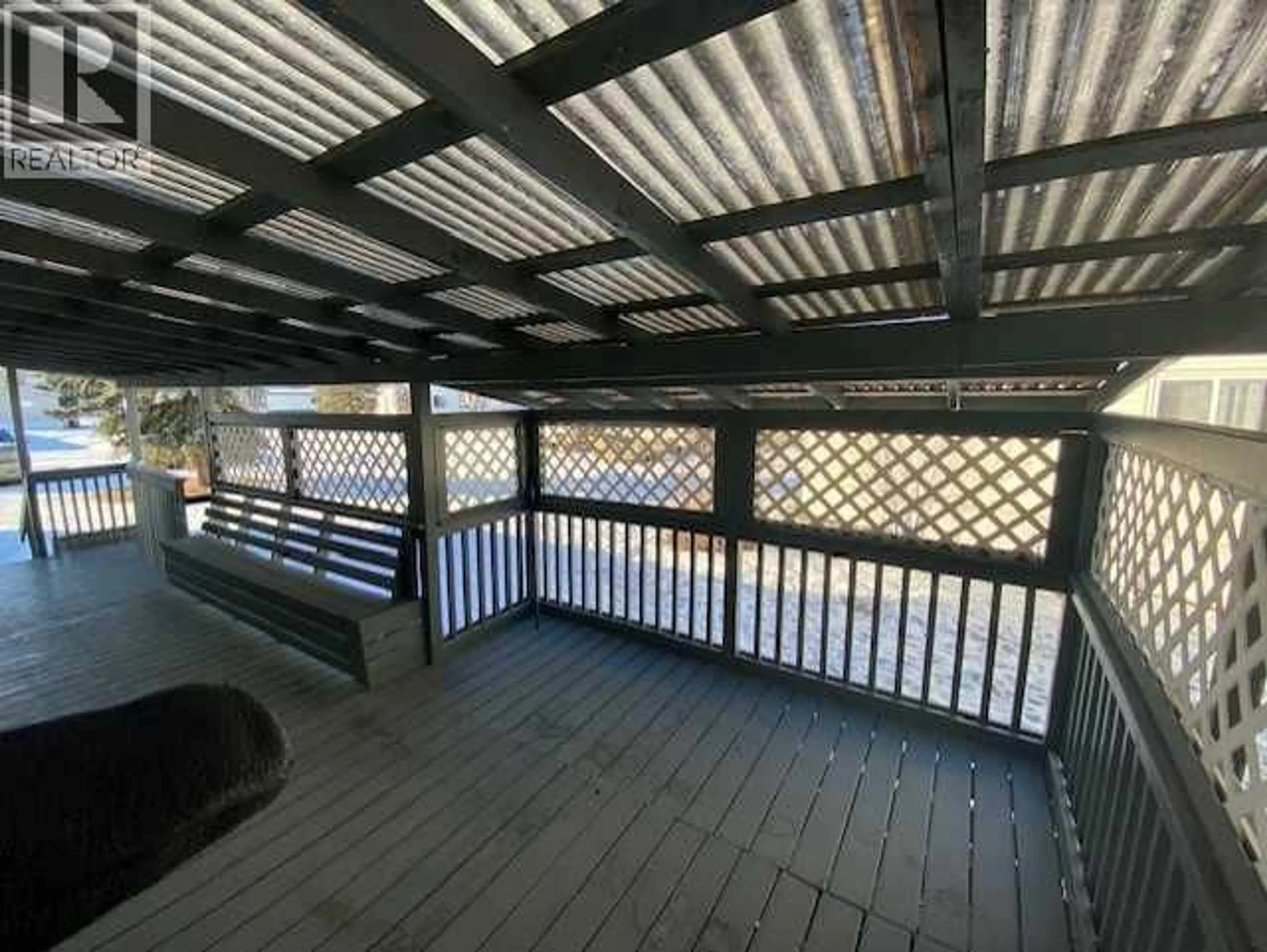 Patio, city buildings view from balcony for 7928 97 AVENUE, Peace River Alberta T8S1W6