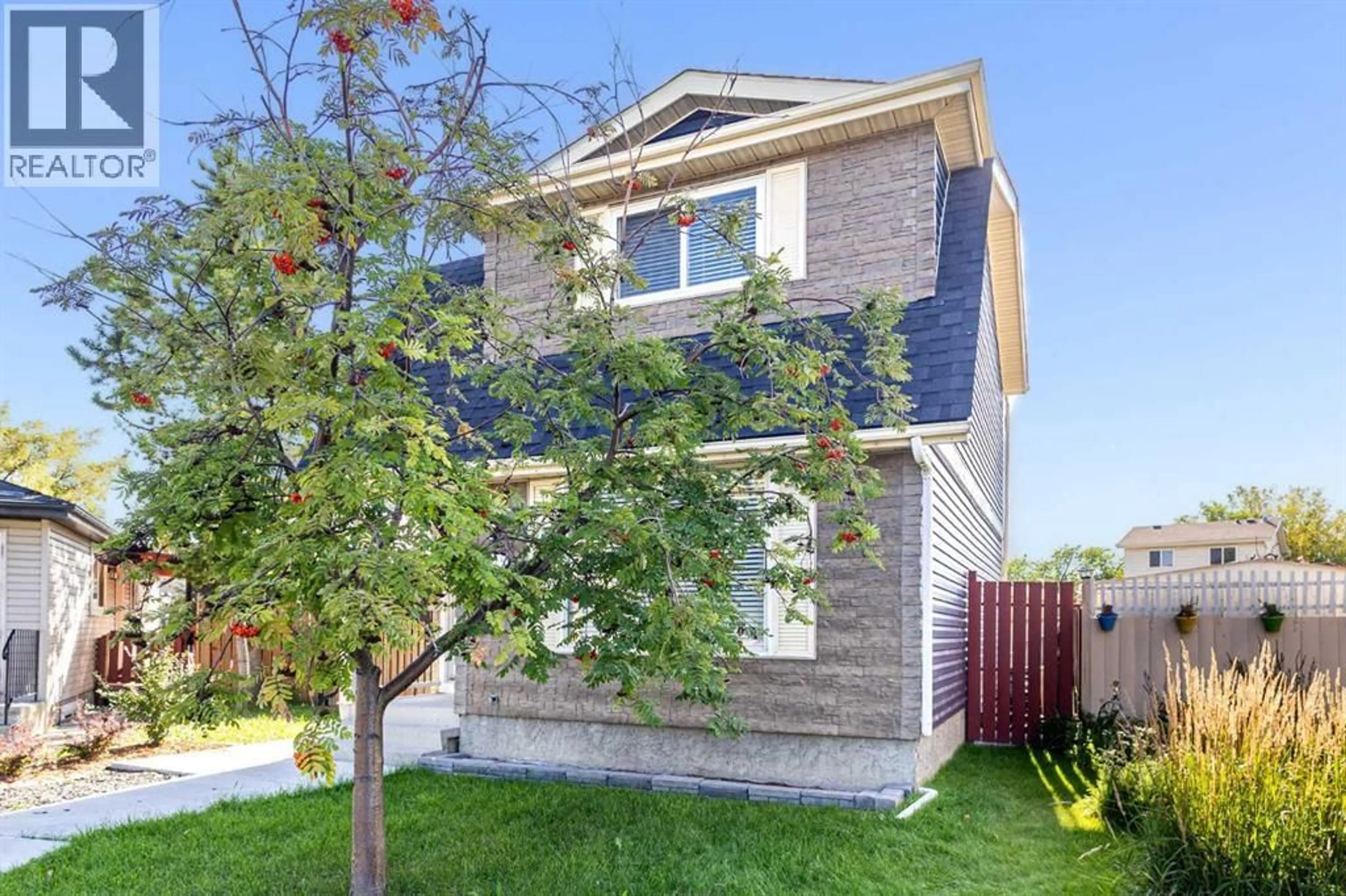 Home with brick exterior material, street for 32 ERIN MOUNT CRESCENT SOUTHEAST, Calgary Alberta T2B2S3