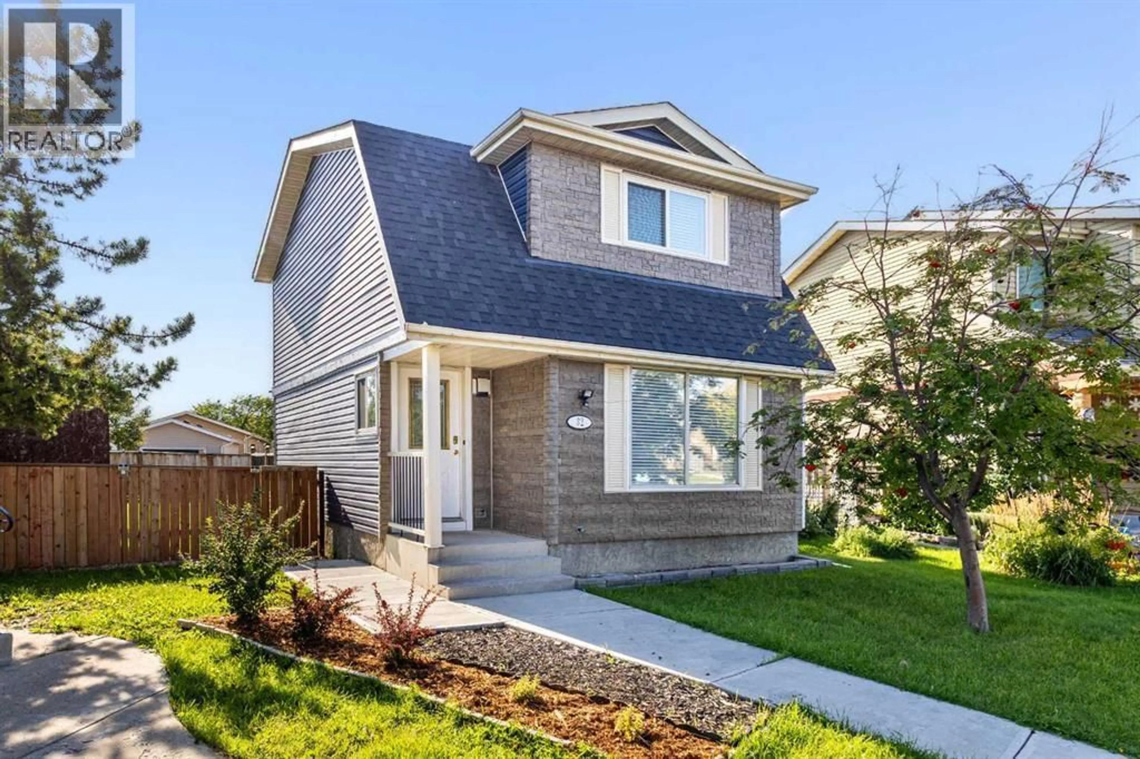 Home with vinyl exterior material, street for 32 ERIN MOUNT CRESCENT SOUTHEAST, Calgary Alberta T2B2S3