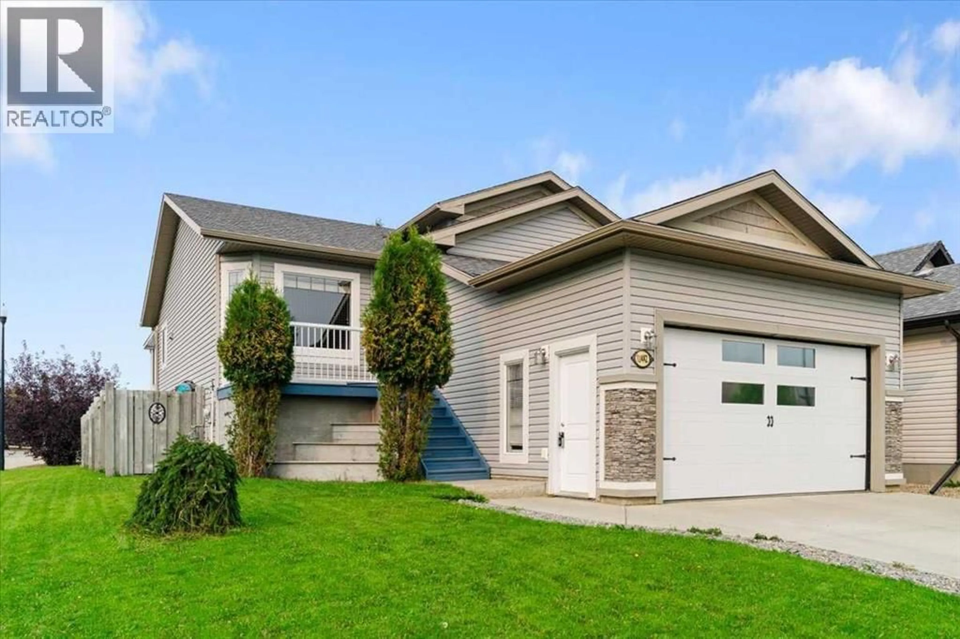 Home with vinyl exterior material, street for 11482 69 AVENUE, Grande Prairie Alberta T8W0E7