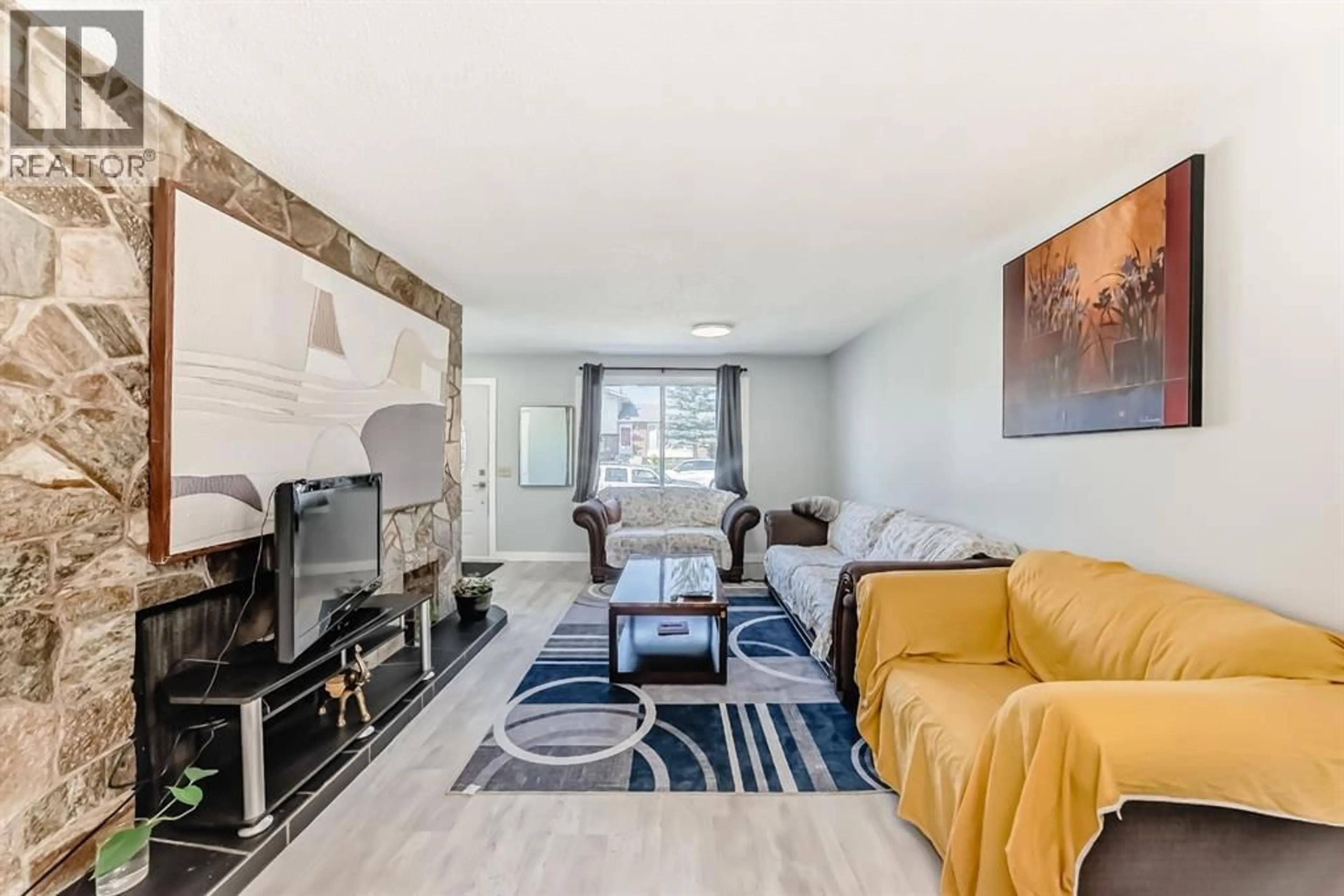 Living room with furniture, unknown for 948 RUNDLECAIRN WAY NORTHEAST, Calgary Alberta T1Y2X2
