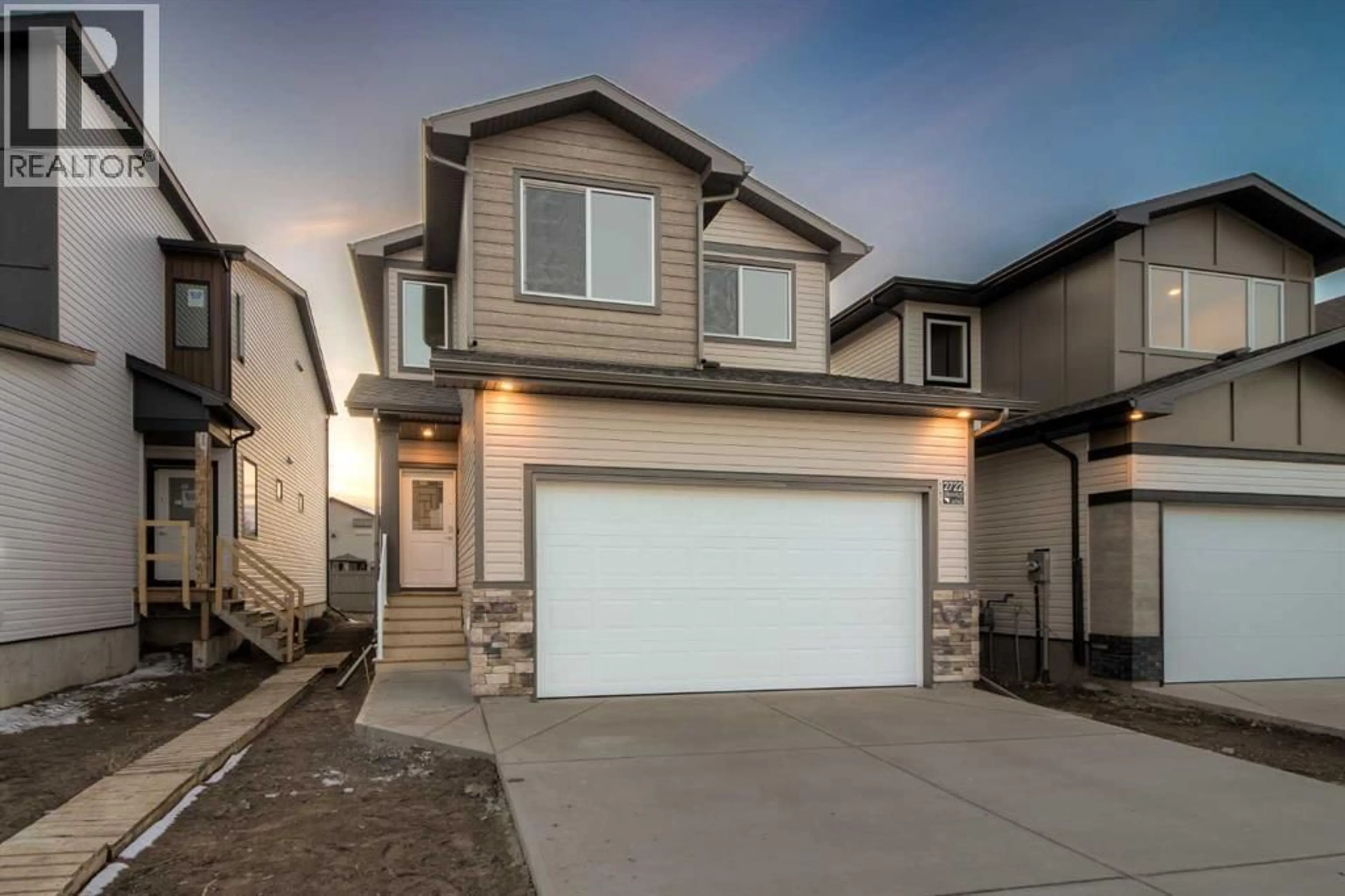 Home with vinyl exterior material, street for 2722 43 STREET SOUTH, Lethbridge Alberta T1K8L3