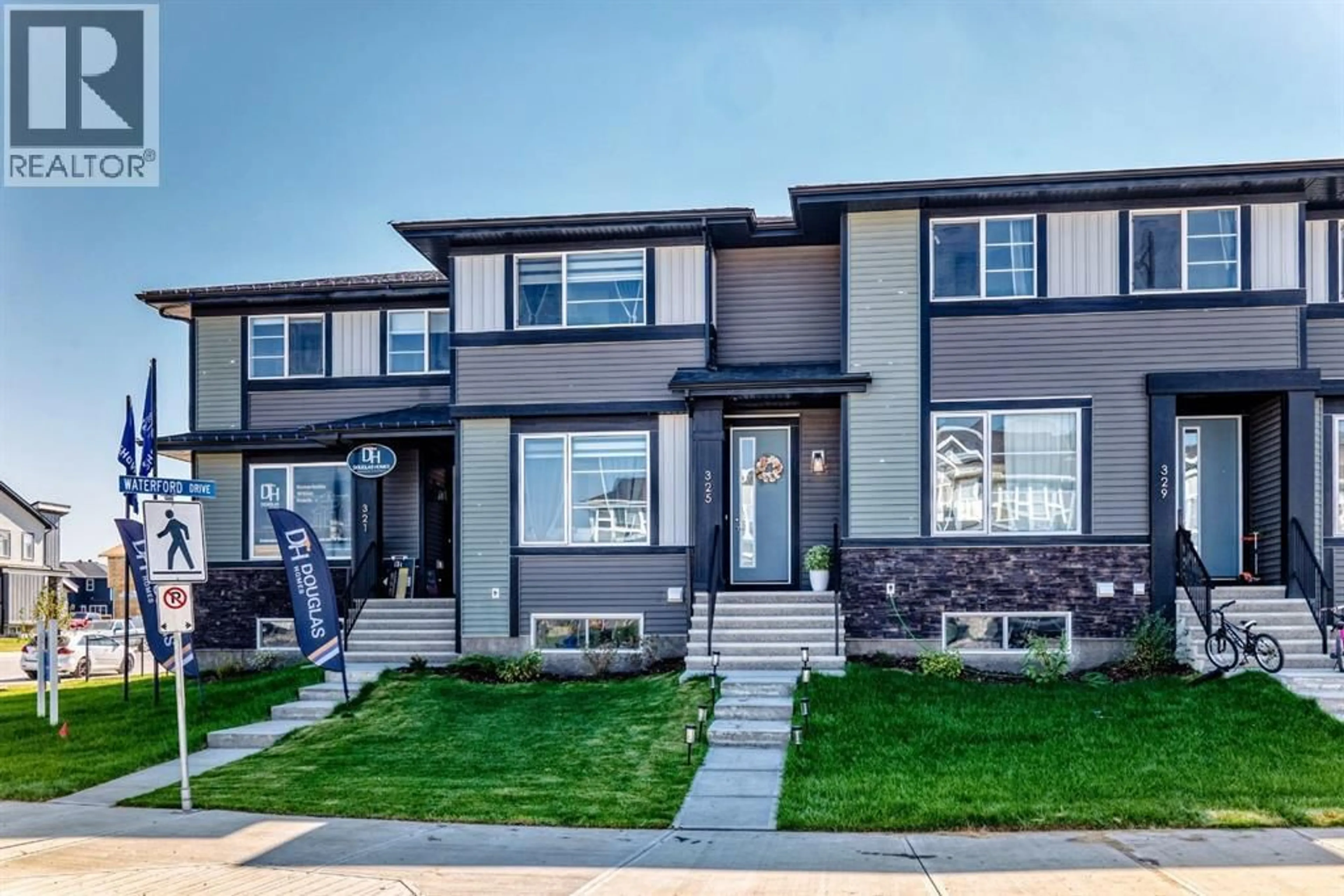 Home with vinyl exterior material, street for 325 WATERFORD BOULEVARD, Chestermere Alberta T1X2Z7