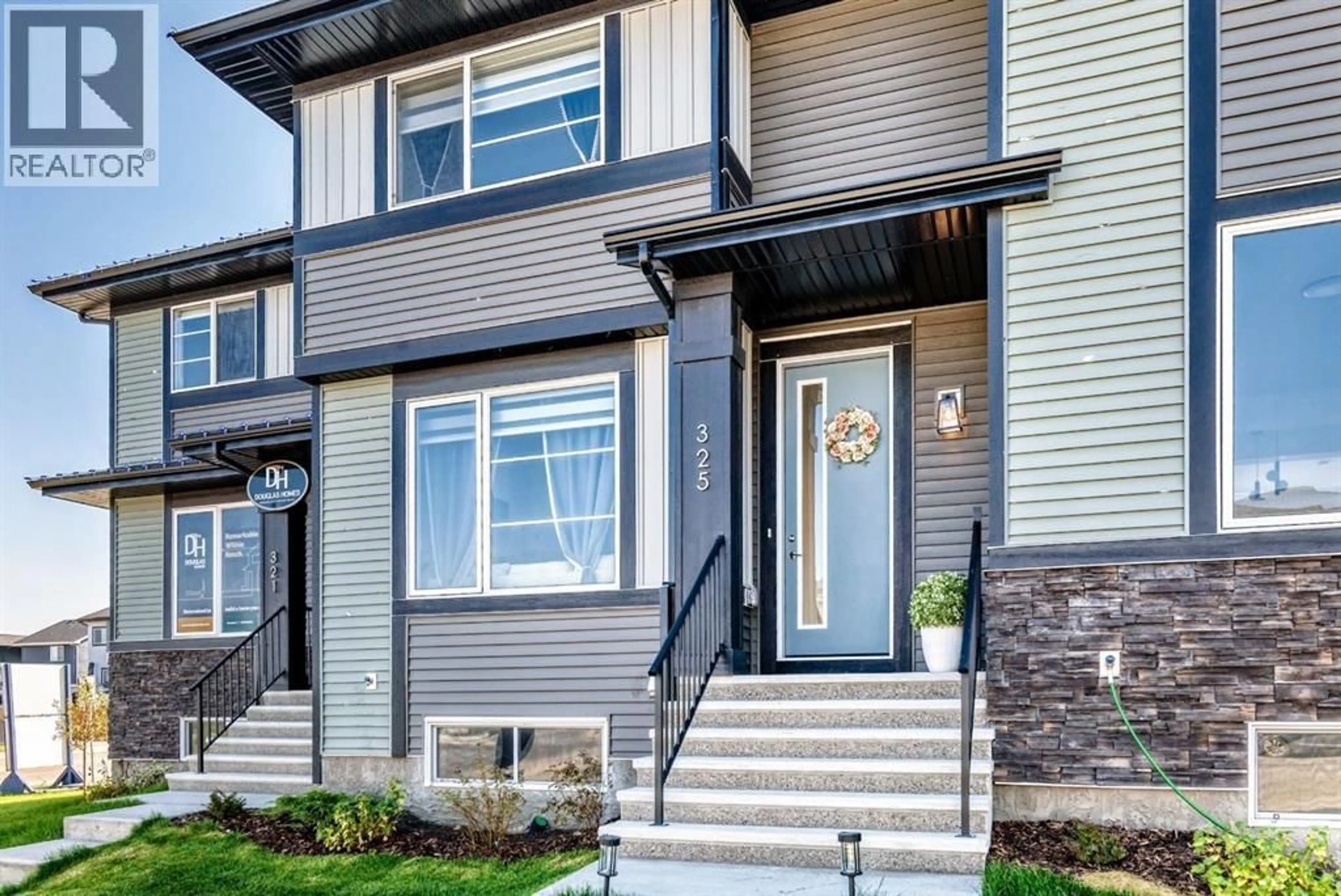Home with vinyl exterior material, street for 325 WATERFORD BOULEVARD, Chestermere Alberta T1X2Z7