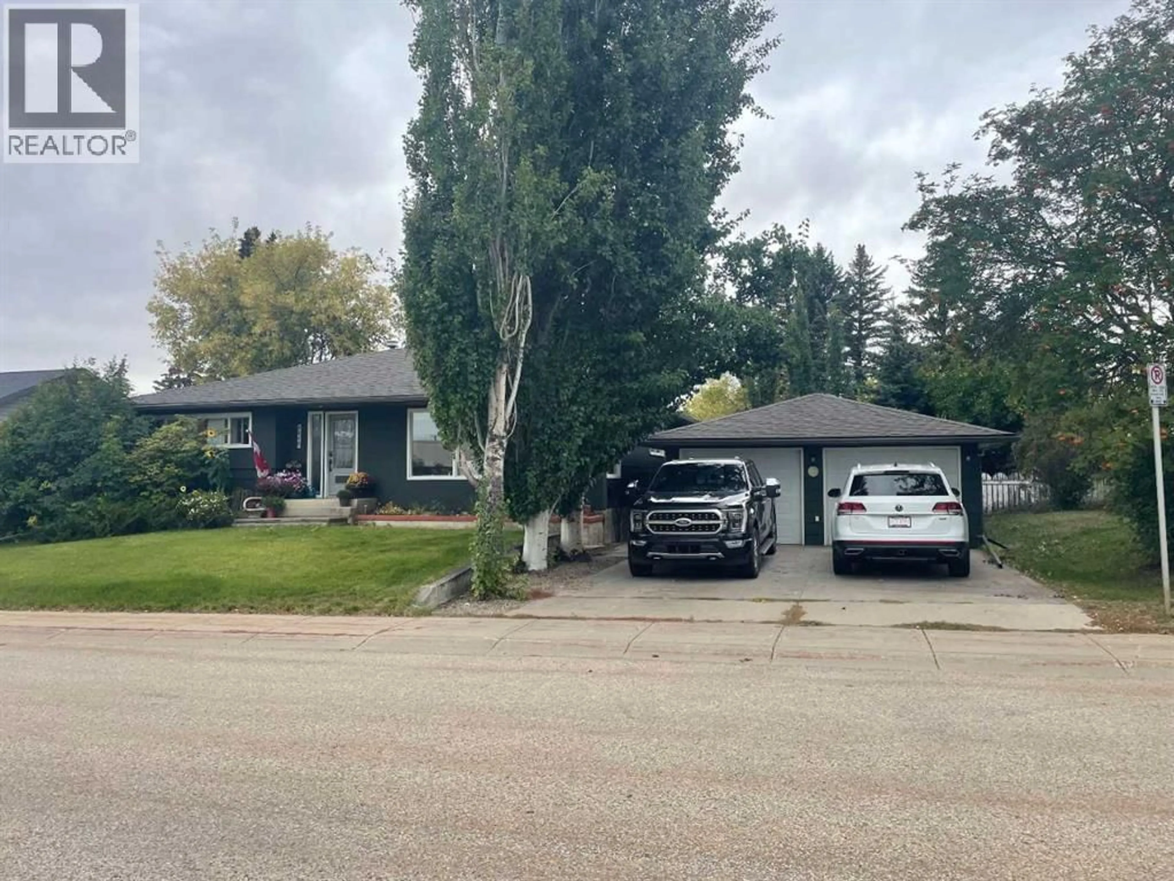 Home with vinyl exterior material, street for 9826 104 AVENUE, Grande Prairie Alberta T8V1E8