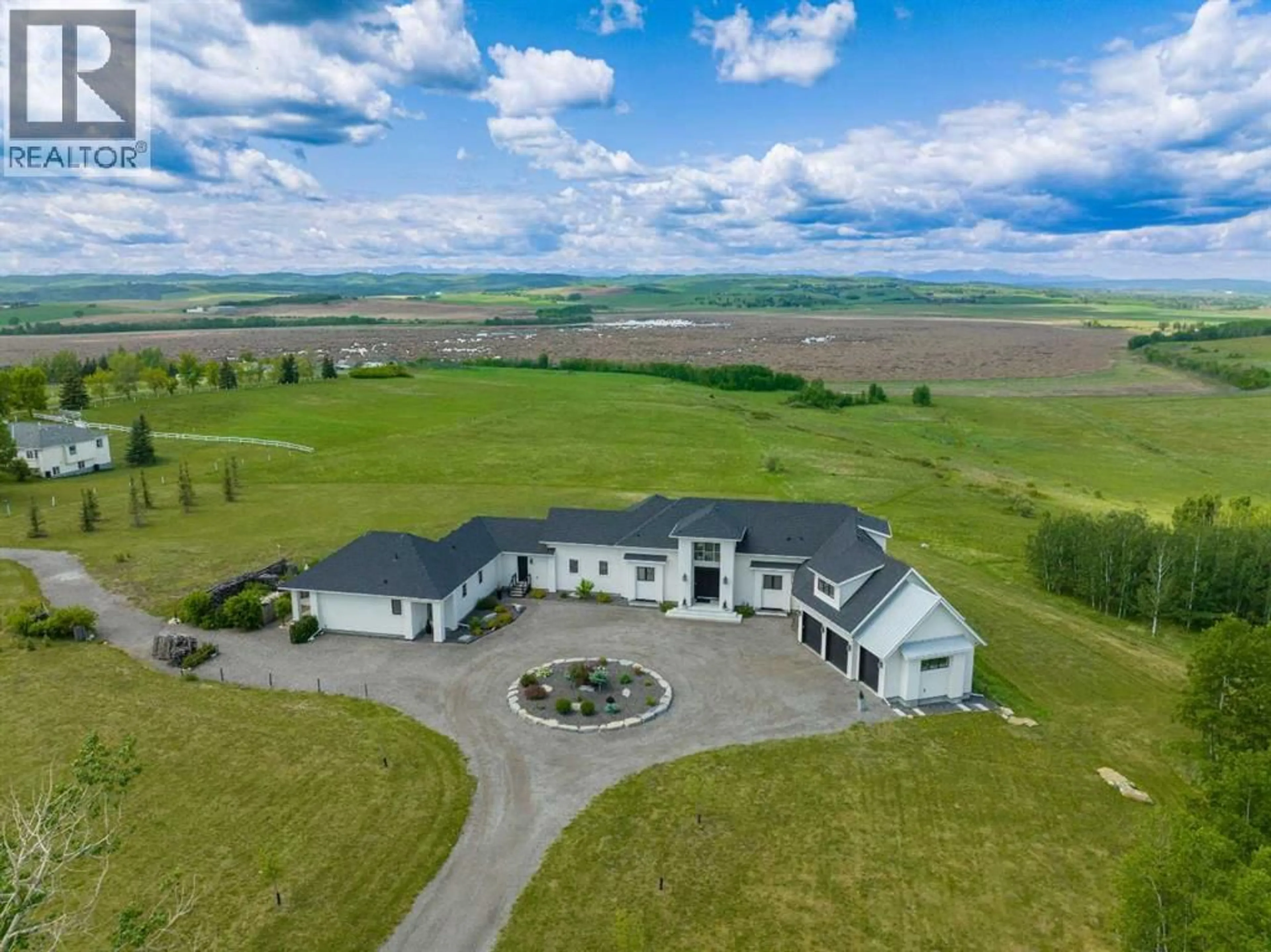 A pic from outside/outdoor area/front of a property/back of a property/a pic from drone, mountain view for 96012 198 AVENUE WEST, Rural Foothills County Alberta T1S2W6