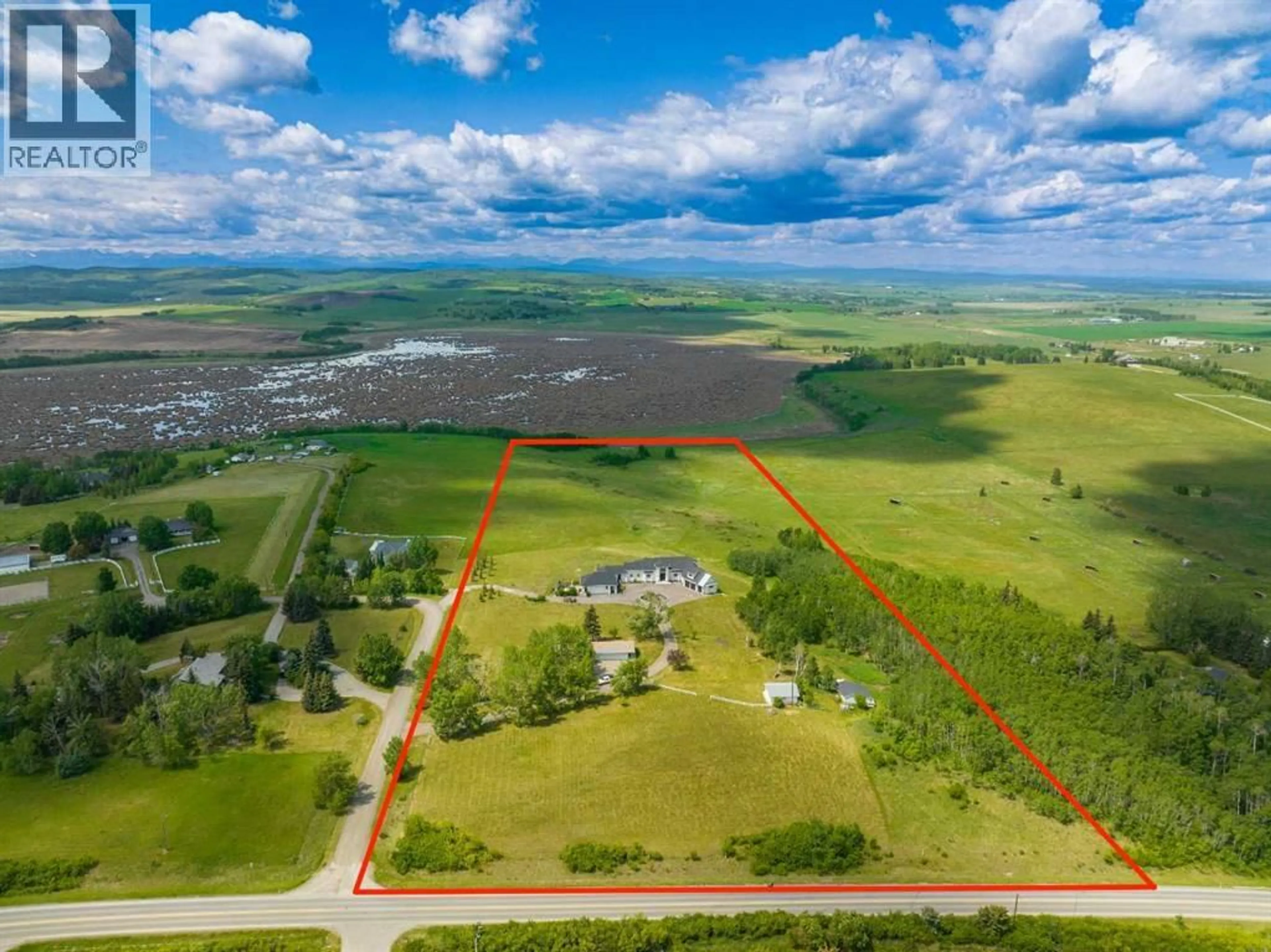A pic from outside/outdoor area/front of a property/back of a property/a pic from drone, water/lake/river/ocean view for 96012 198 AVENUE WEST, Rural Foothills County Alberta T1S2W6