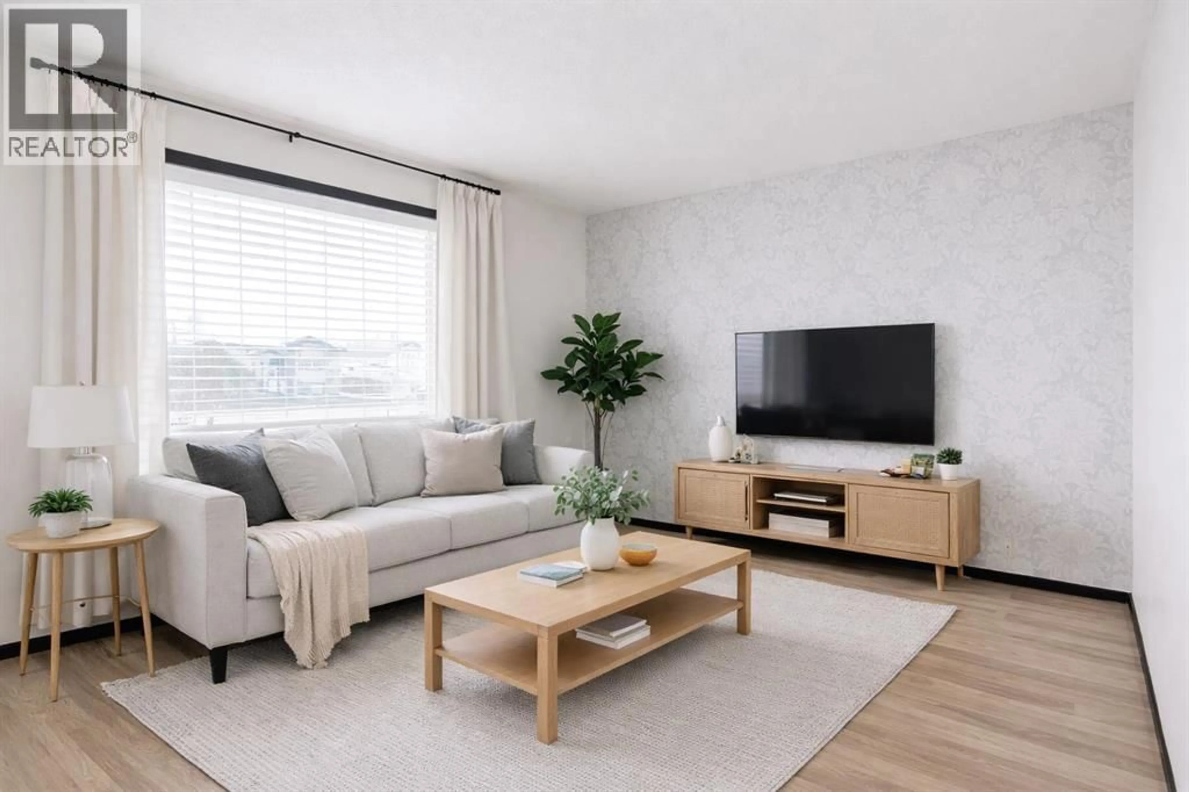 Living room with furniture, wood/laminate floor for 16 JOHNSON CLOSE, Penhold Alberta T0M0R1