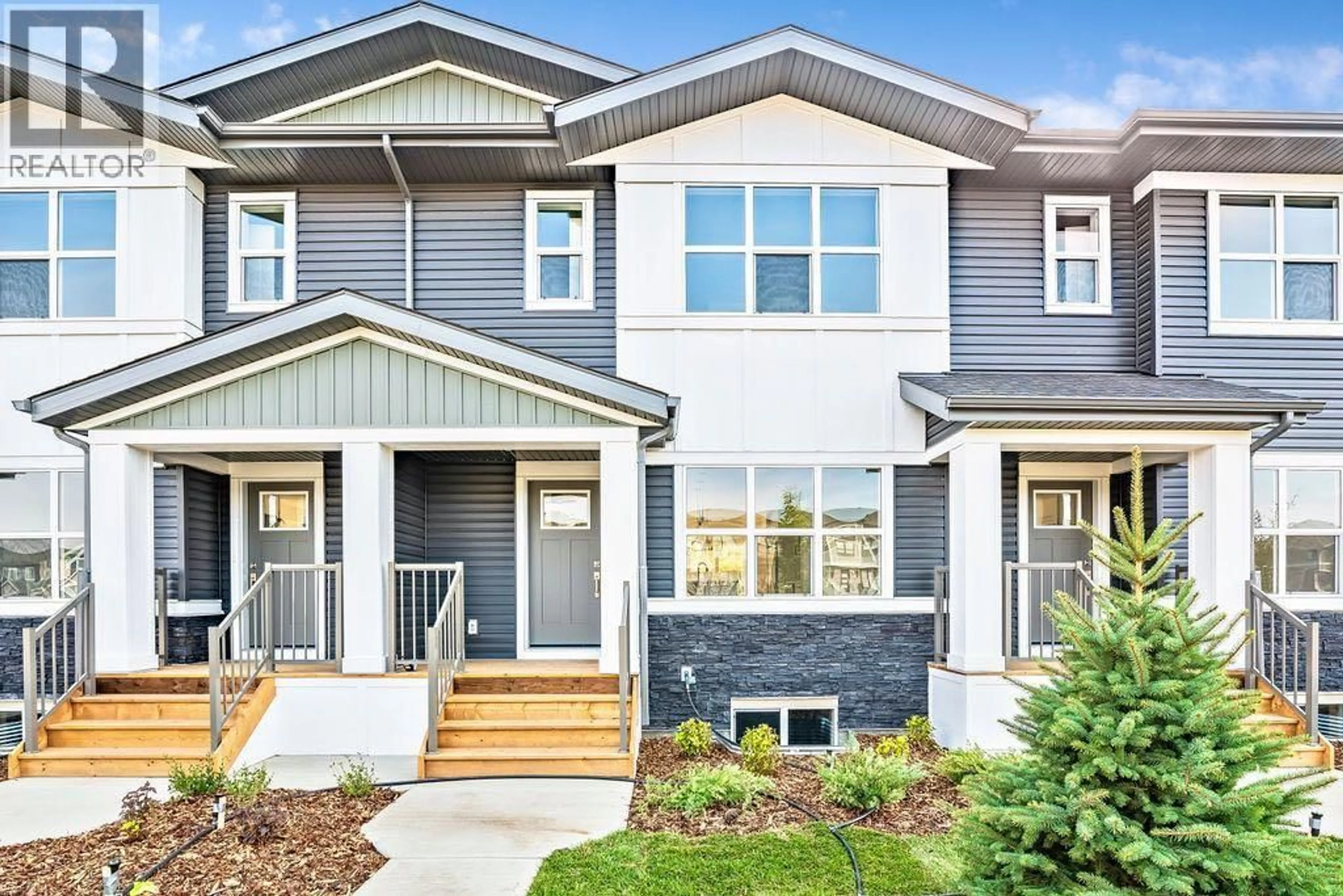 Home with vinyl exterior material, street for 525 RIVER HEIGHTS DRIVE, Cochrane Alberta T4C3E3