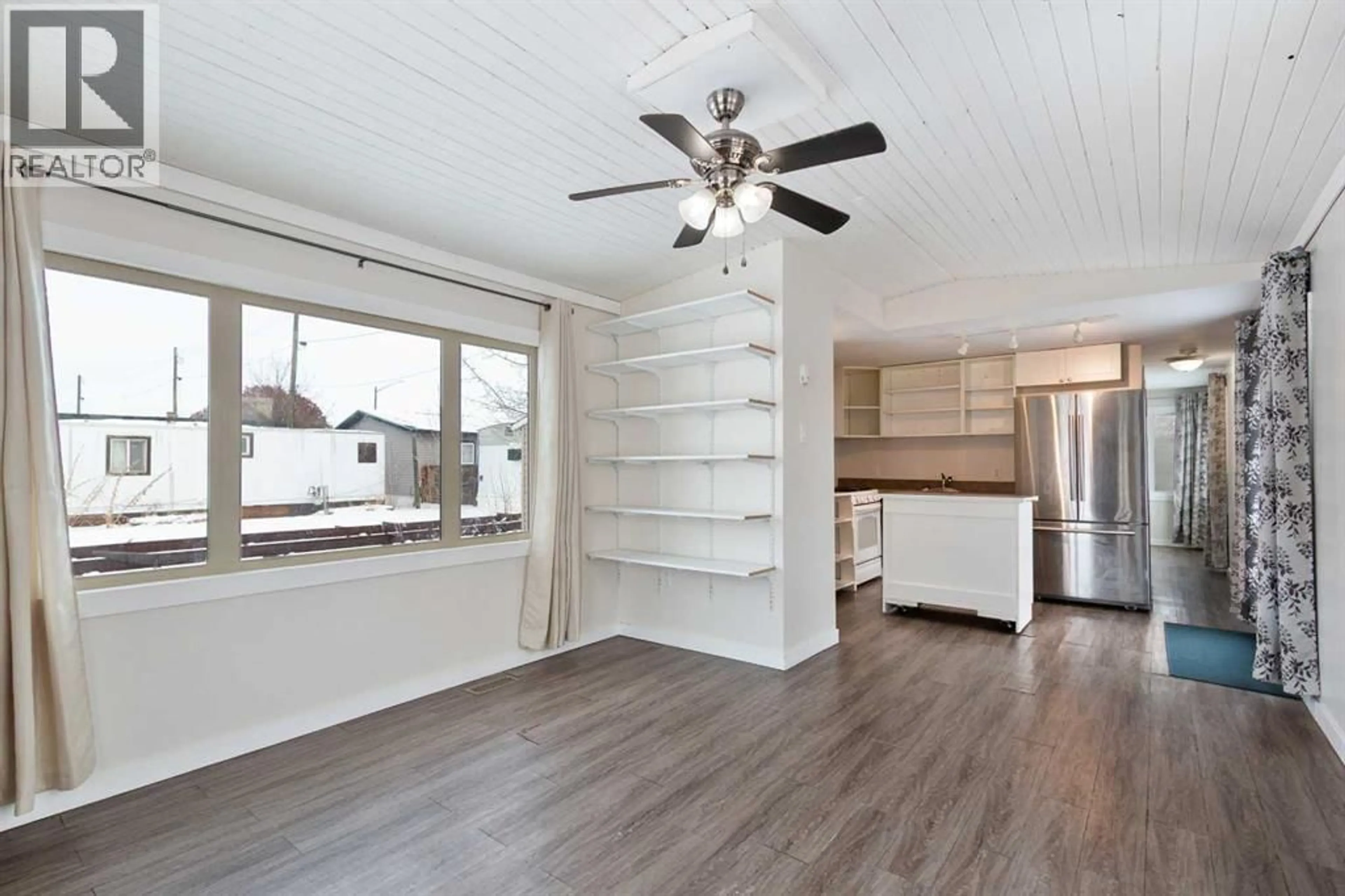 Open concept kitchen, wood/laminate floor for 1 PARK AVENUE, Carstairs Alberta T0M0N0