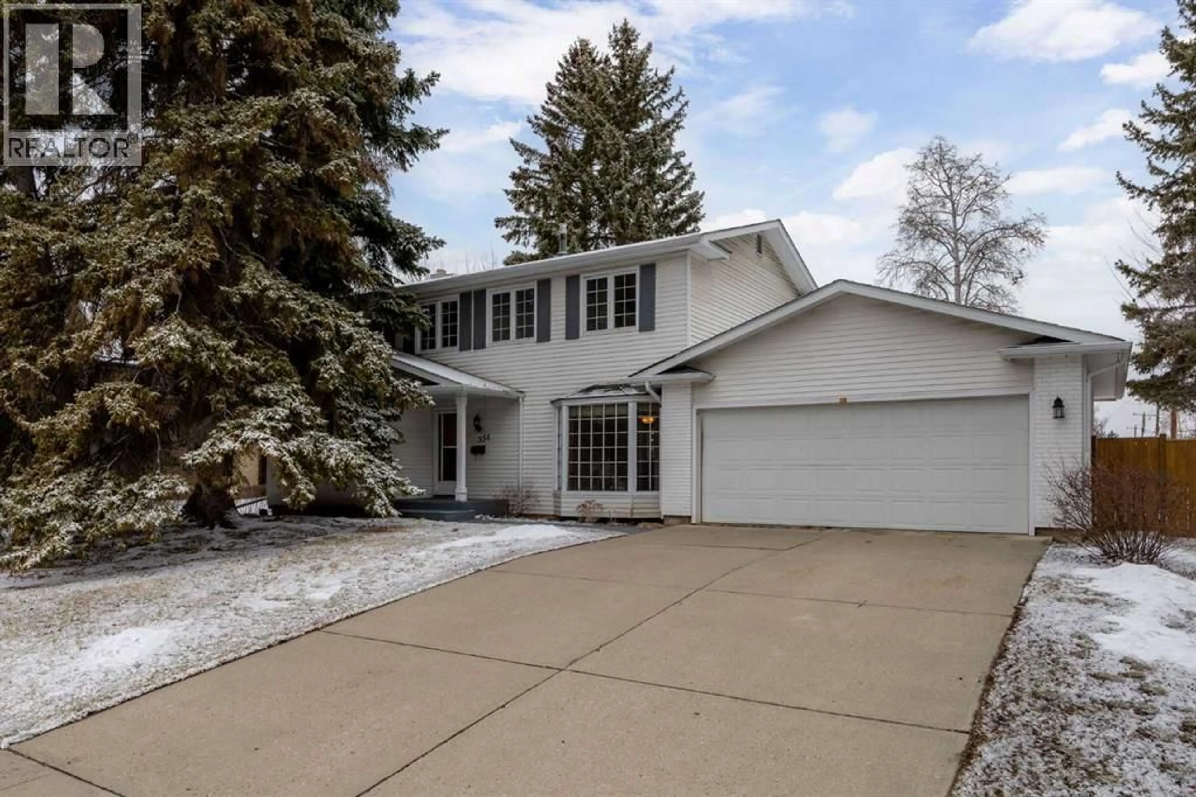 Home with vinyl exterior material, street for 356 WILLOW RIDGE PLACE SOUTHEAST, Calgary Alberta T2J1N4