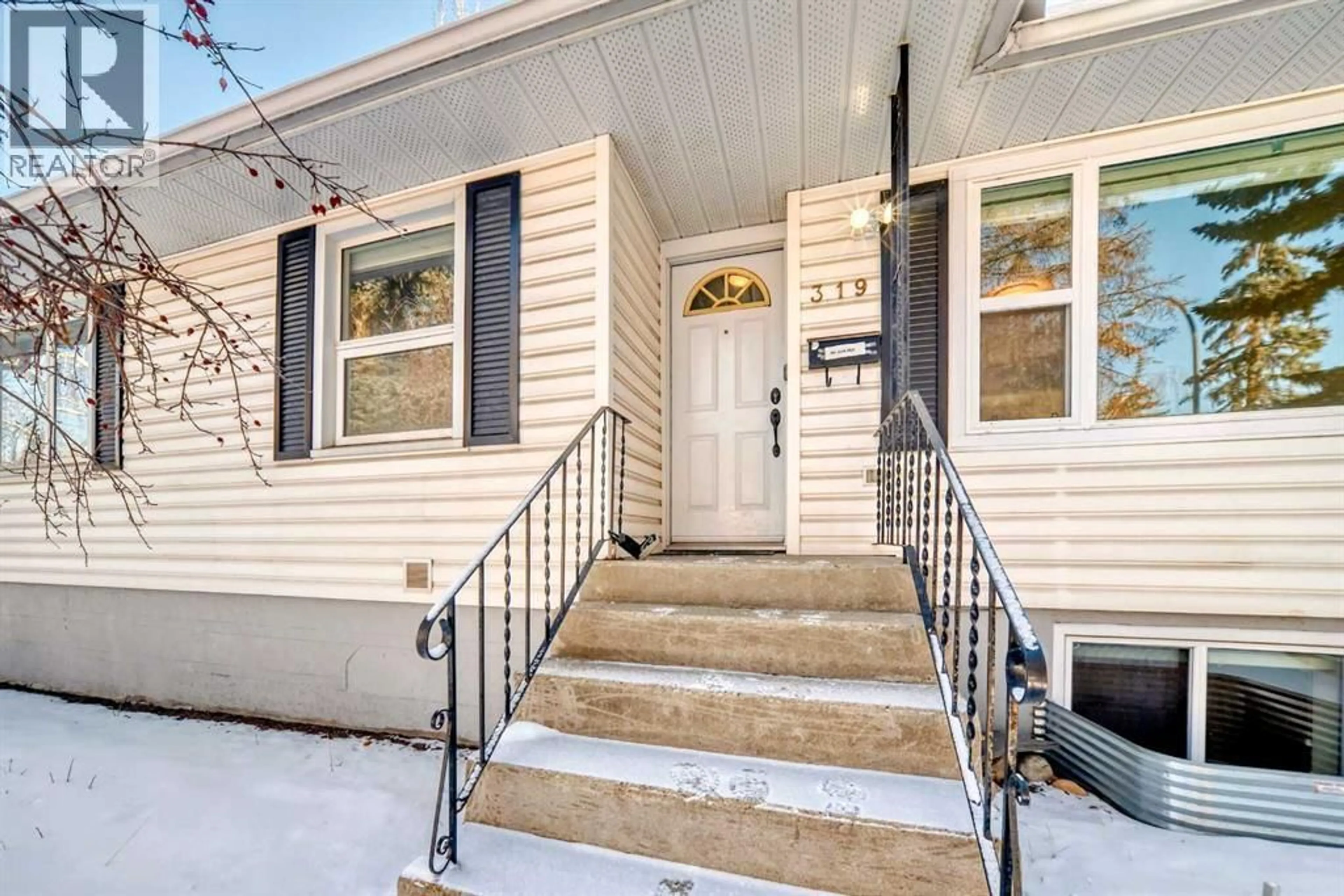 Home with vinyl exterior material, street for 319 45 AVENUE SOUTHWEST, Calgary Alberta T2S1B3