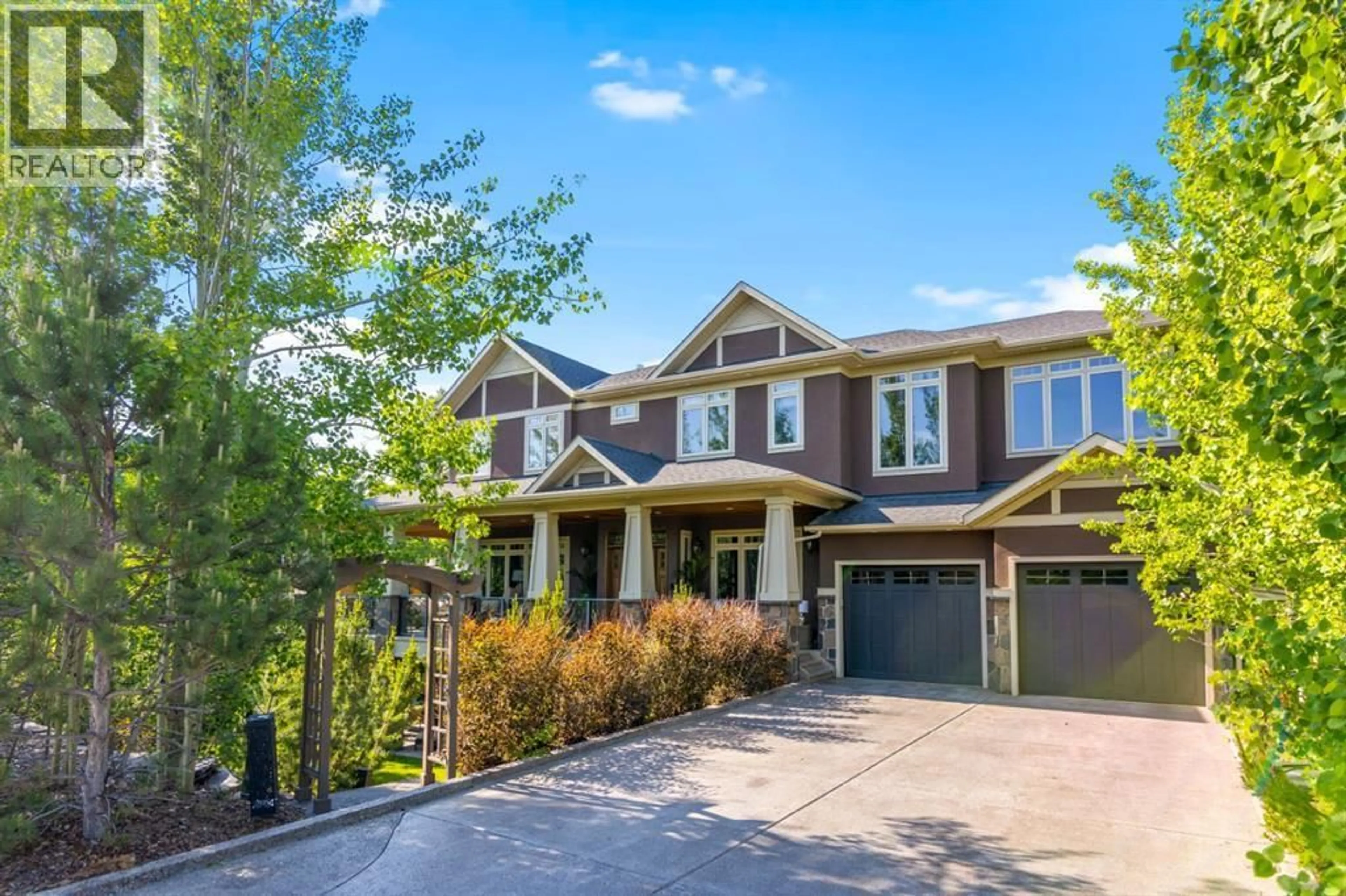 Home with brick exterior material, street for 108 POSTHILL DRIVE SOUTHWEST, Calgary Alberta T3H0J1