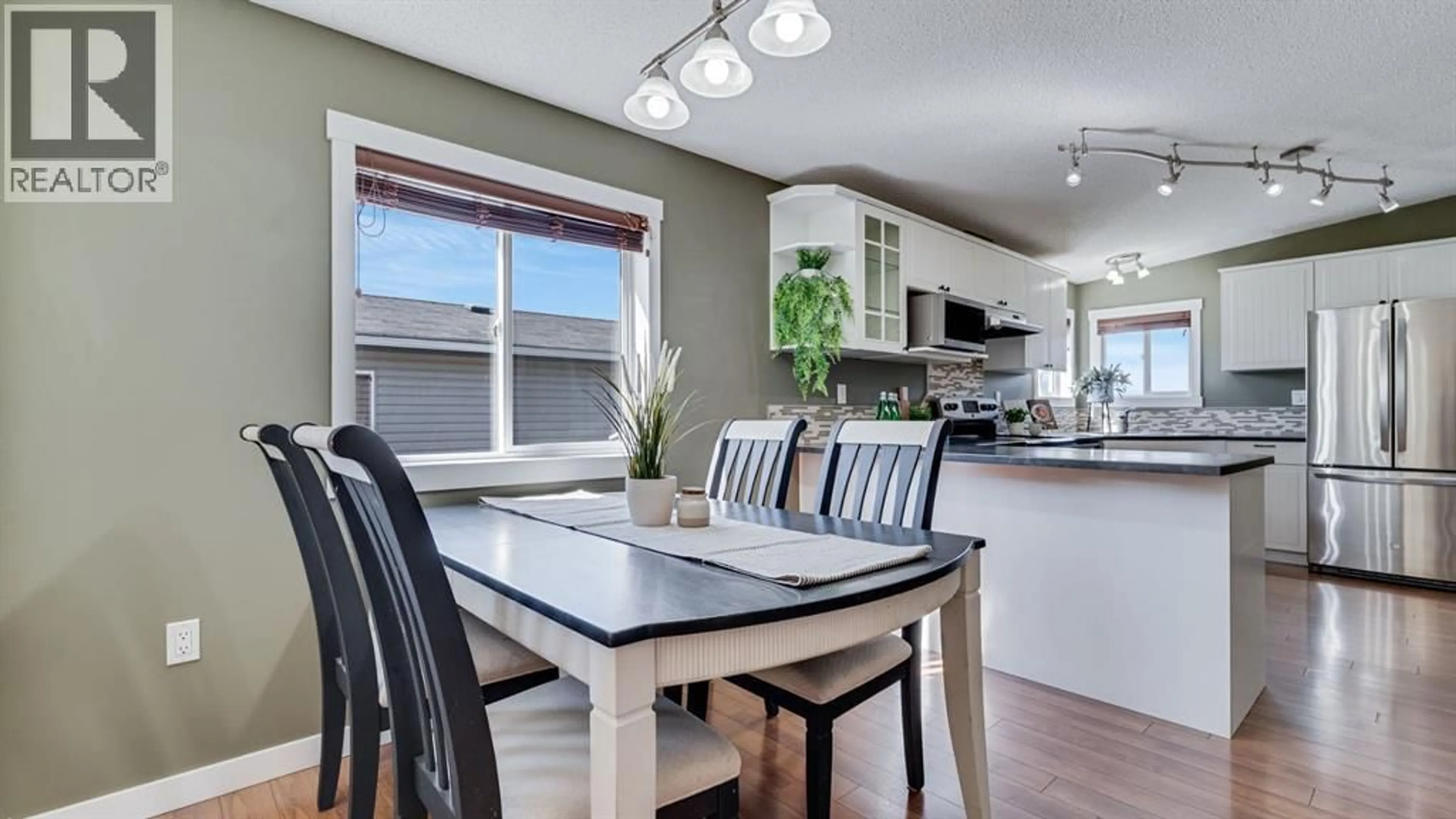 Open concept kitchen, wood/laminate floor for 156 MEADOWLARK LANE, Carstairs Alberta T0M0N0