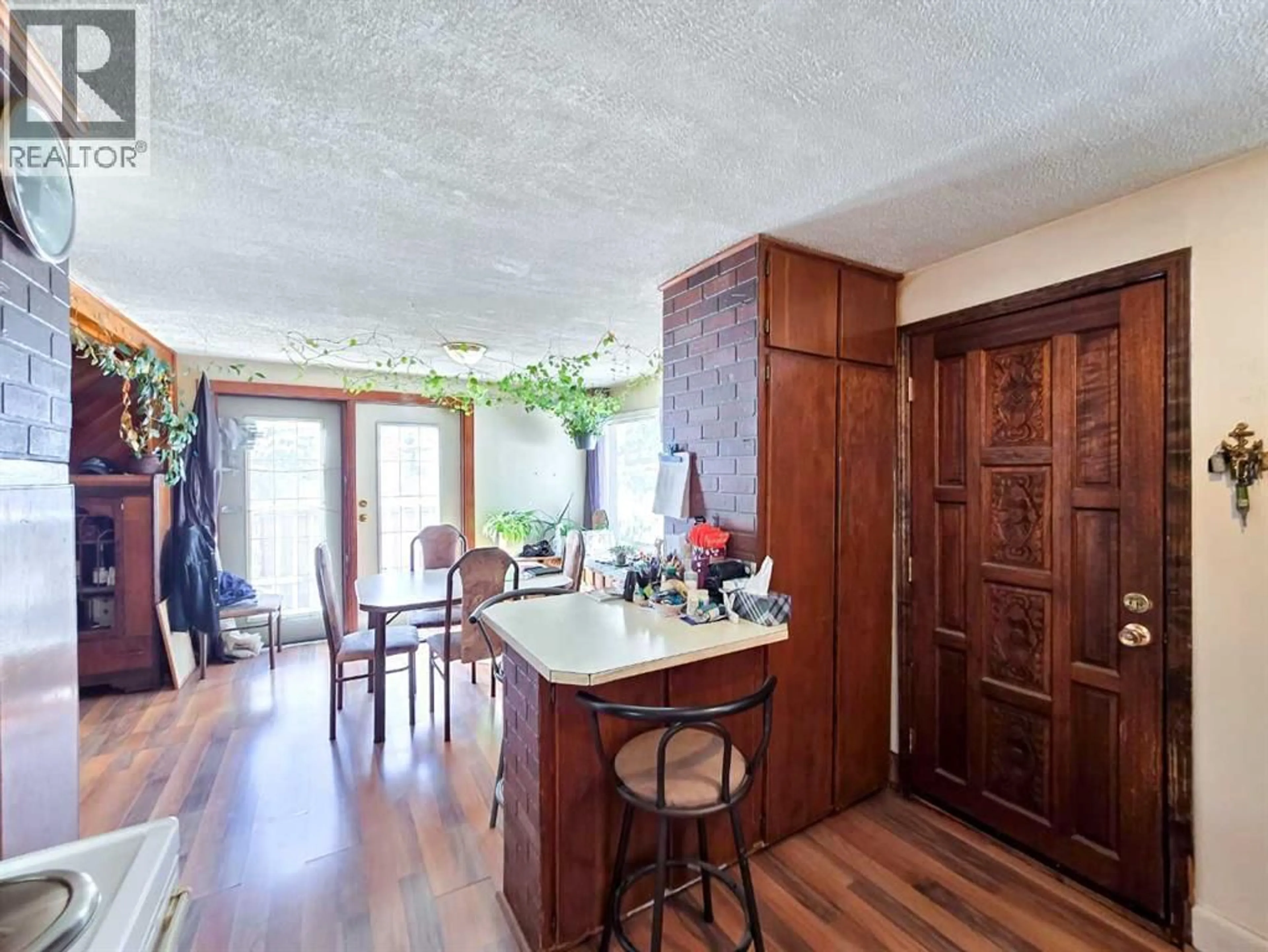 Dining room, wood/laminate floor for 1201 83 STREET, Coleman Alberta T0K0M0