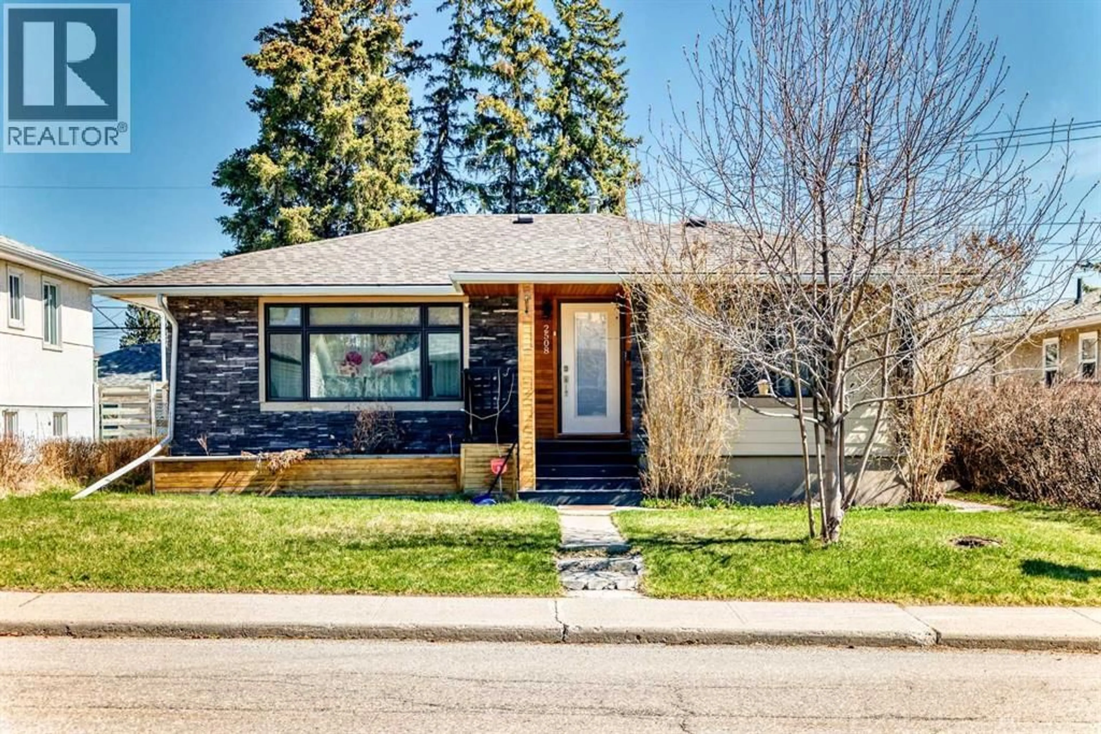 Home with brick exterior material, street for 2508 MORLEY TRAIL NORTHWEST, Calgary Alberta T2M4G6