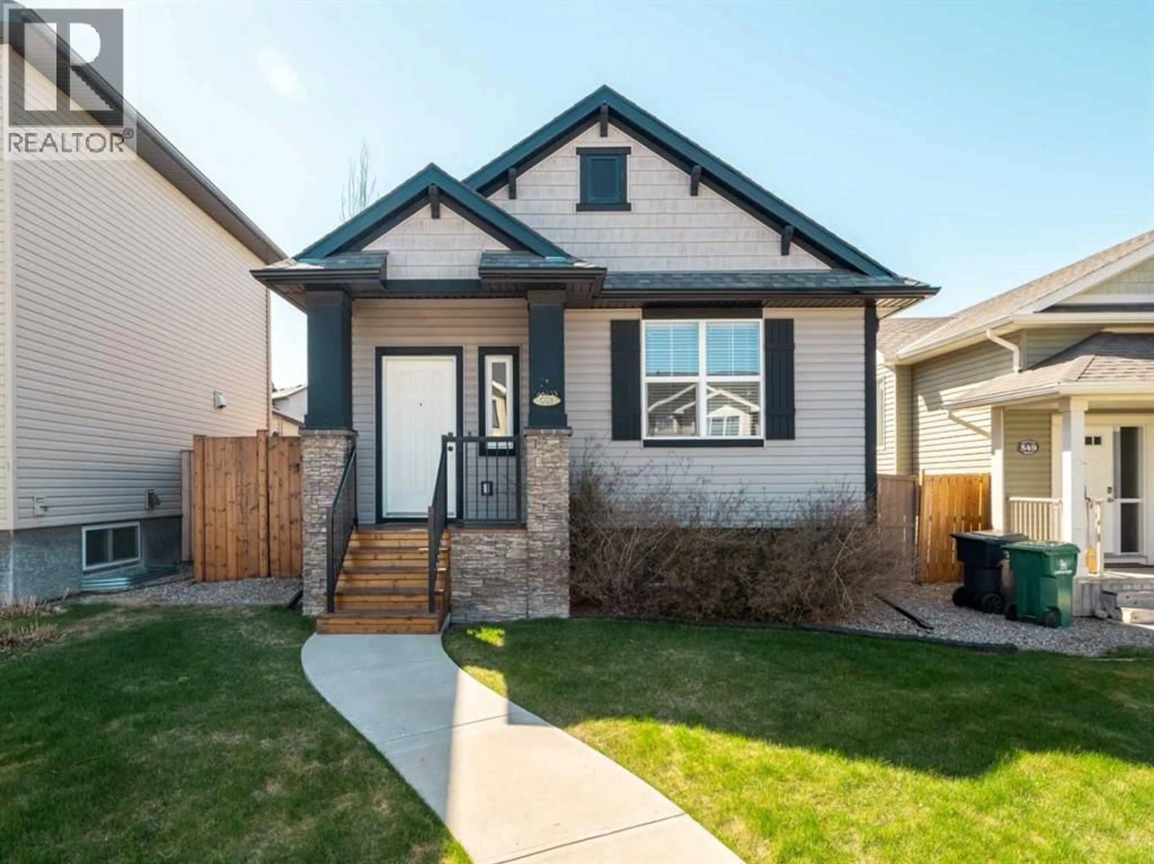 Home with vinyl exterior material, street for 553 MARY CAMERON CRESCENT NORTH, Lethbridge Alberta T1H6V6