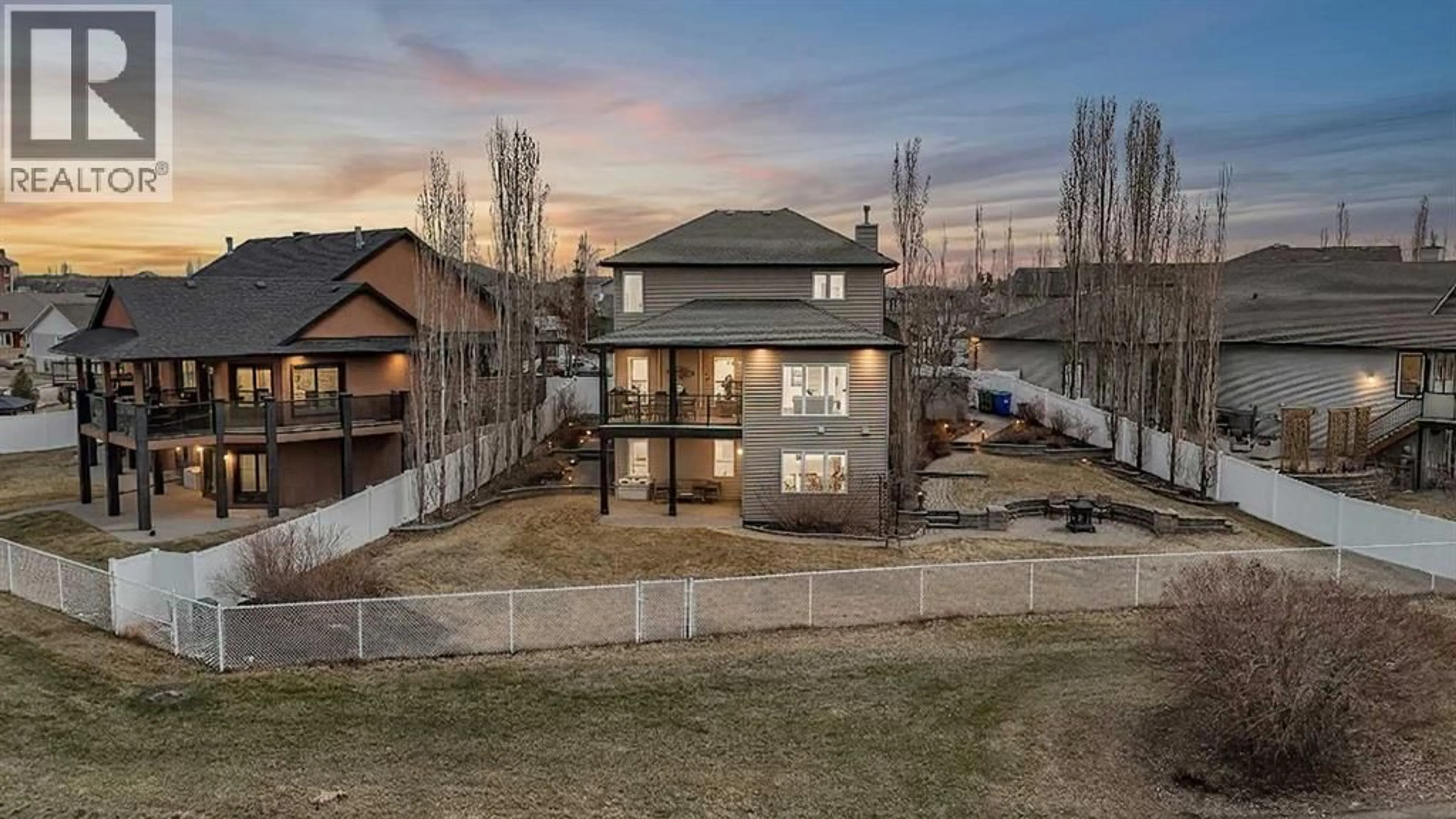A pic from outside/outdoor area/front of a property/back of a property/a pic from drone, mountain view for 74 INGRAM CLOSE, Red Deer Alberta T4R0A3