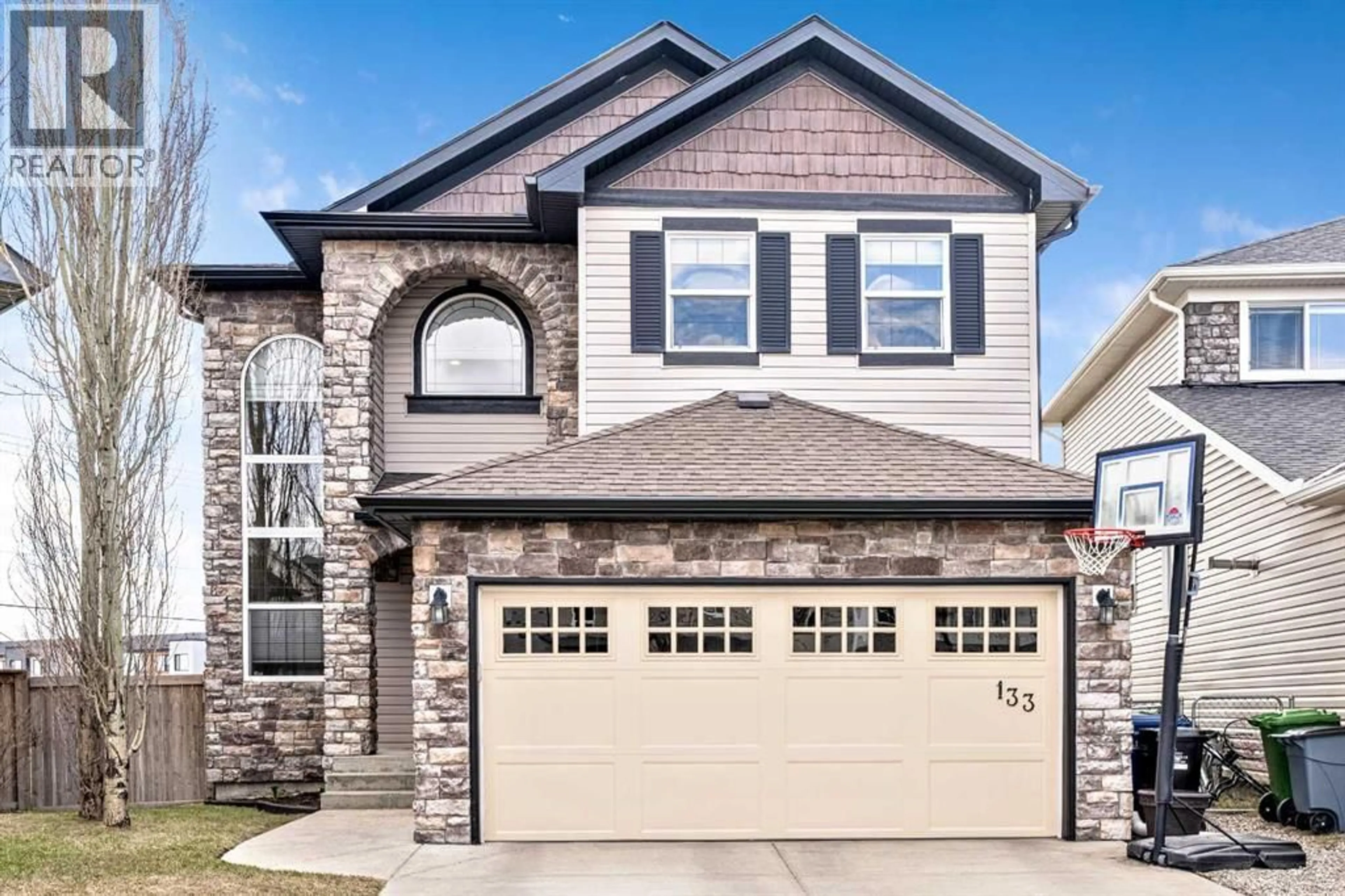 Home with brick exterior material, street for 133 CHANNELSIDE COVE SOUTHWEST, Airdrie Alberta T4B2J1
