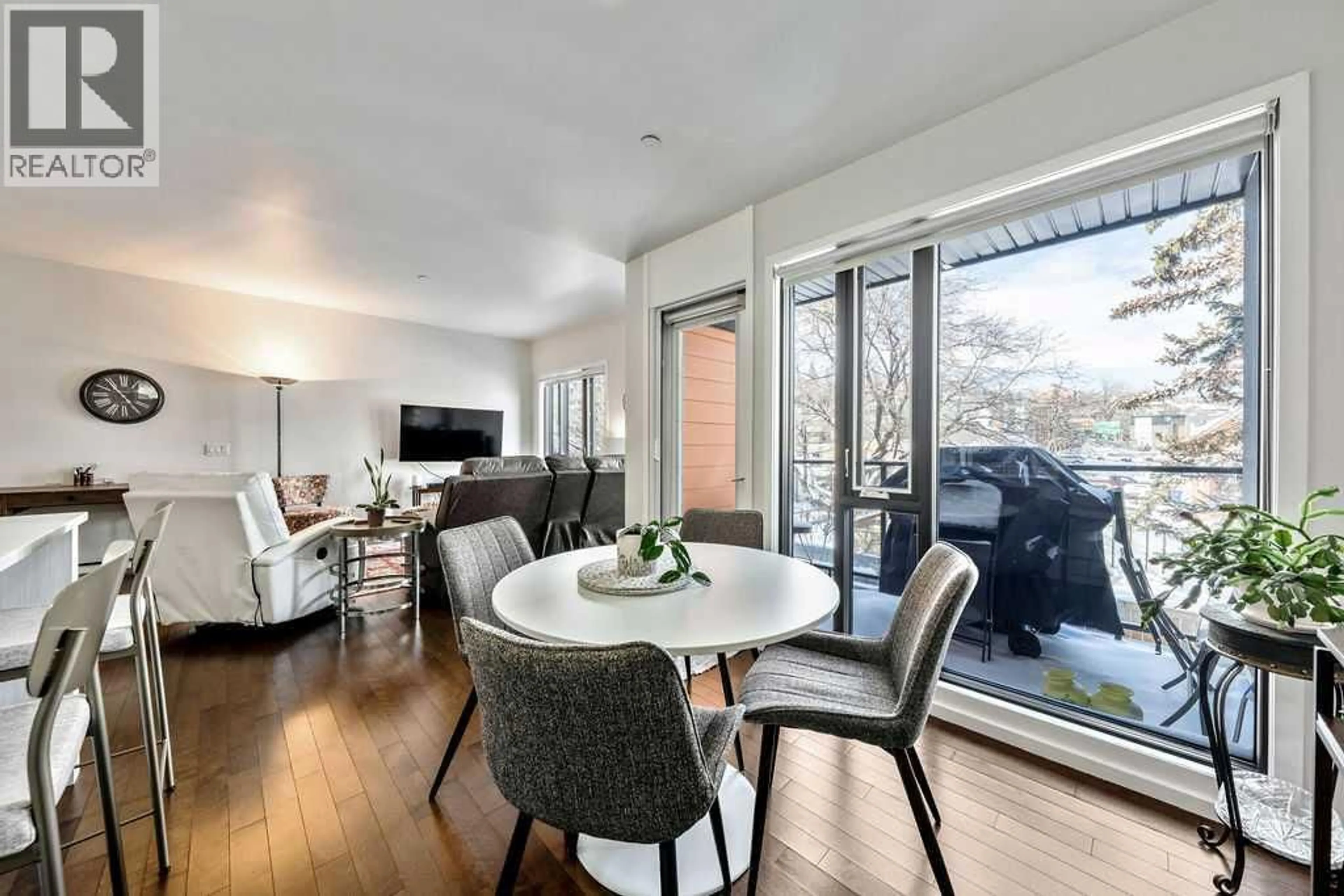 Living room with furniture, wood/laminate floor for 414 MEREDITH ROAD NORTHEAST, Calgary Alberta T2E5A6