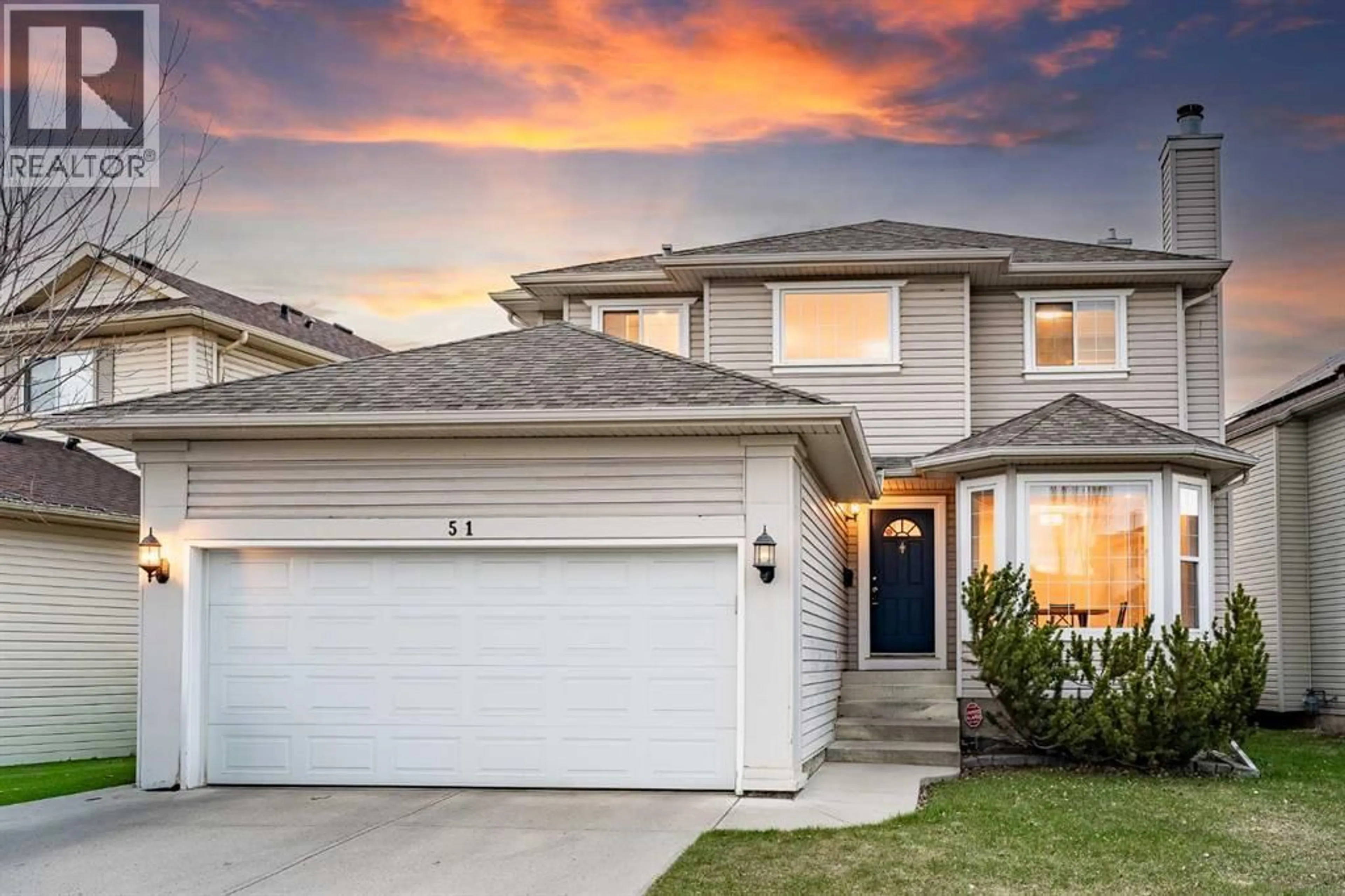 Home with vinyl exterior material, street for 51 SIERRA NEVADA WAY SOUTHWEST, Calgary Alberta T3H3M6