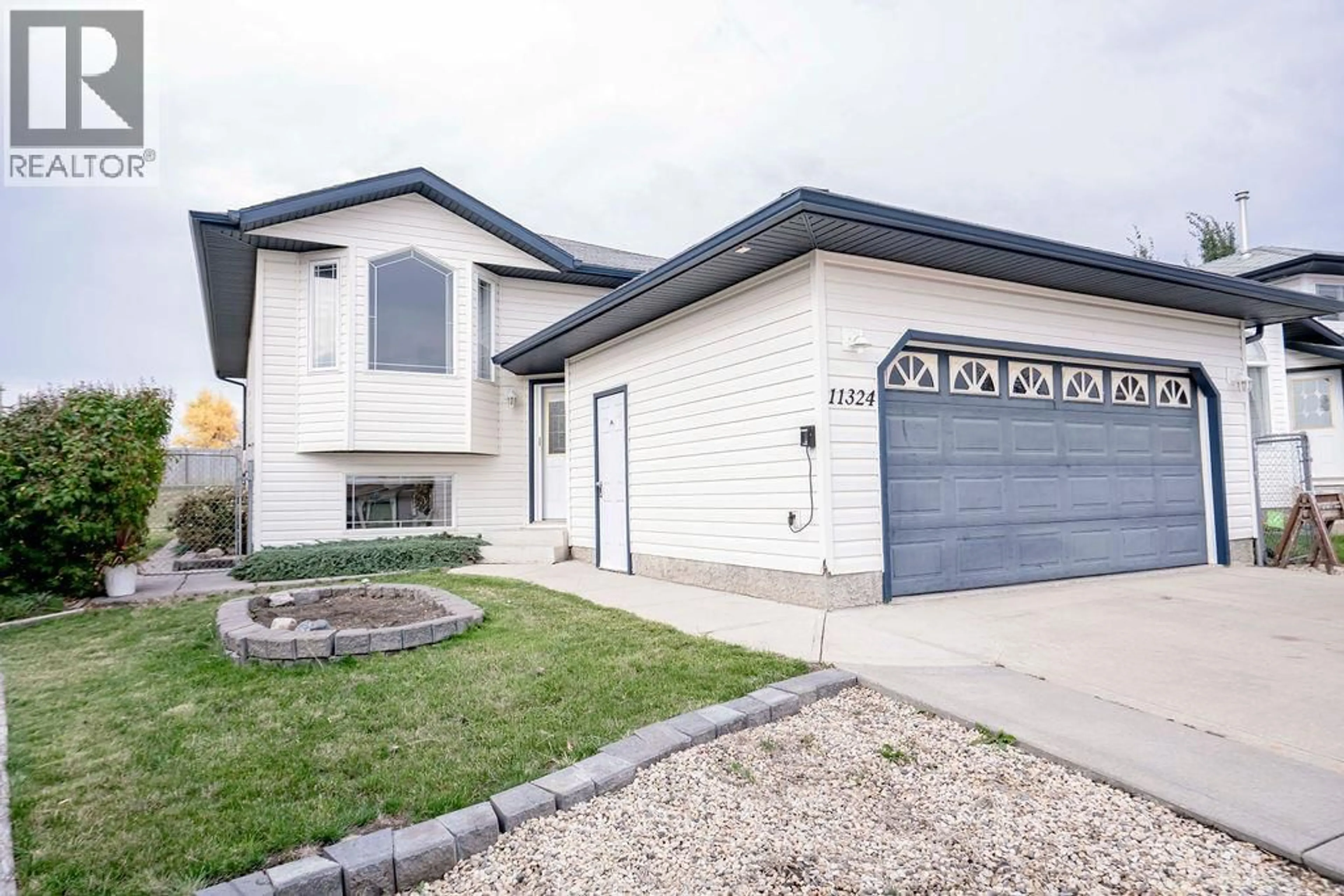 Home with vinyl exterior material, street for 11324 91 STREET, Grande Prairie Alberta T8X1M4