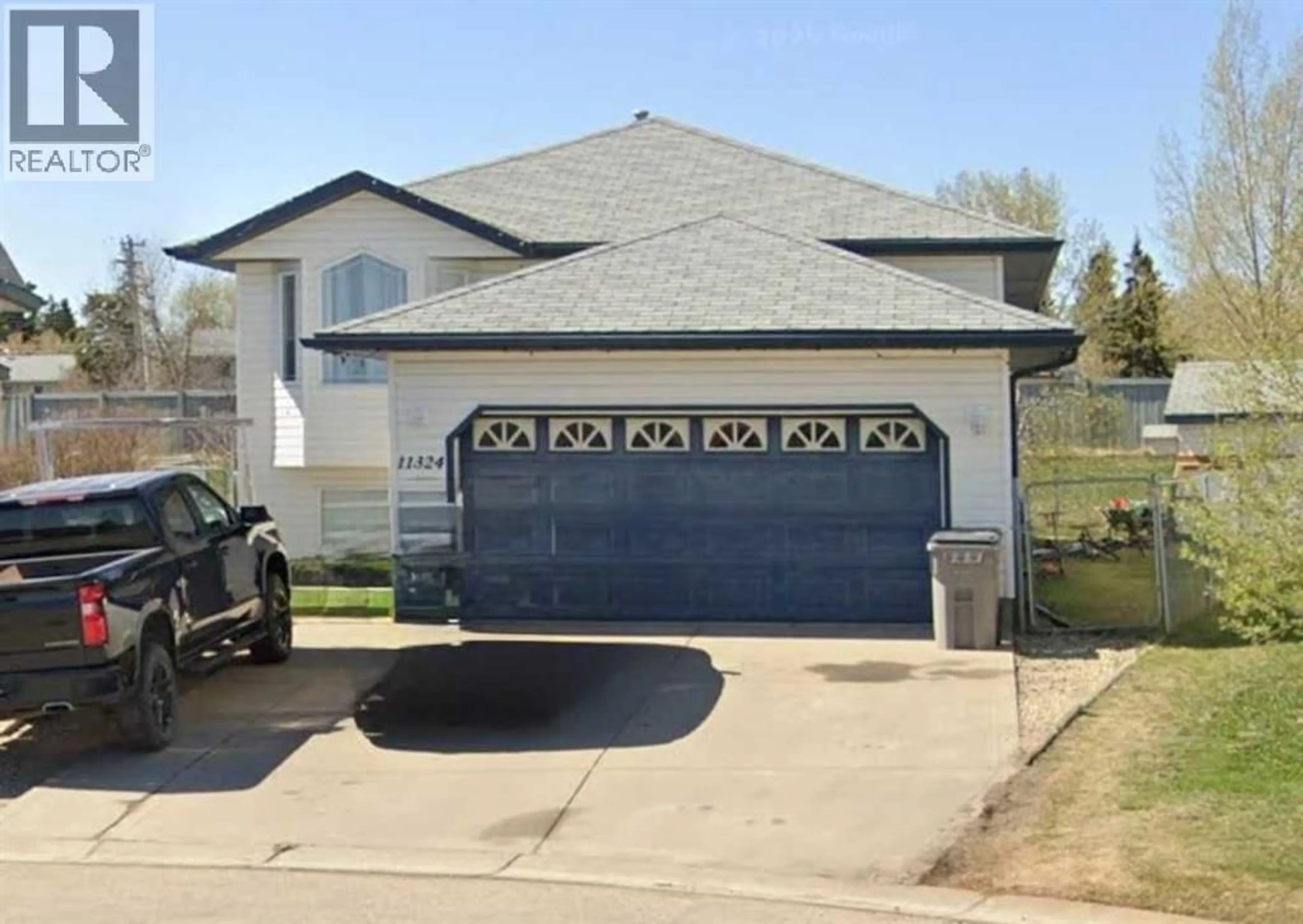Home with vinyl exterior material, street for 11324 91 STREET, Grande Prairie Alberta T8X1M4