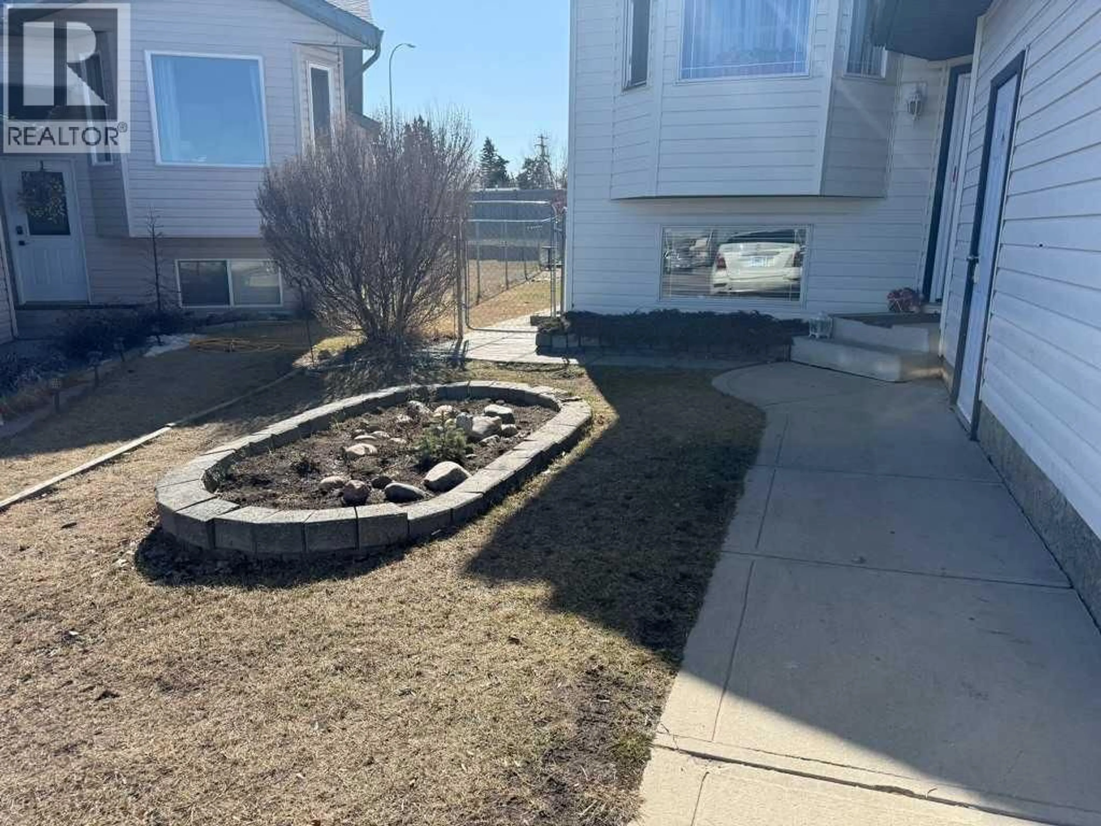 A pic from outside/outdoor area/front of a property/back of a property/a pic from drone, unknown for 11324 91 STREET, Grande Prairie Alberta T8X1M4