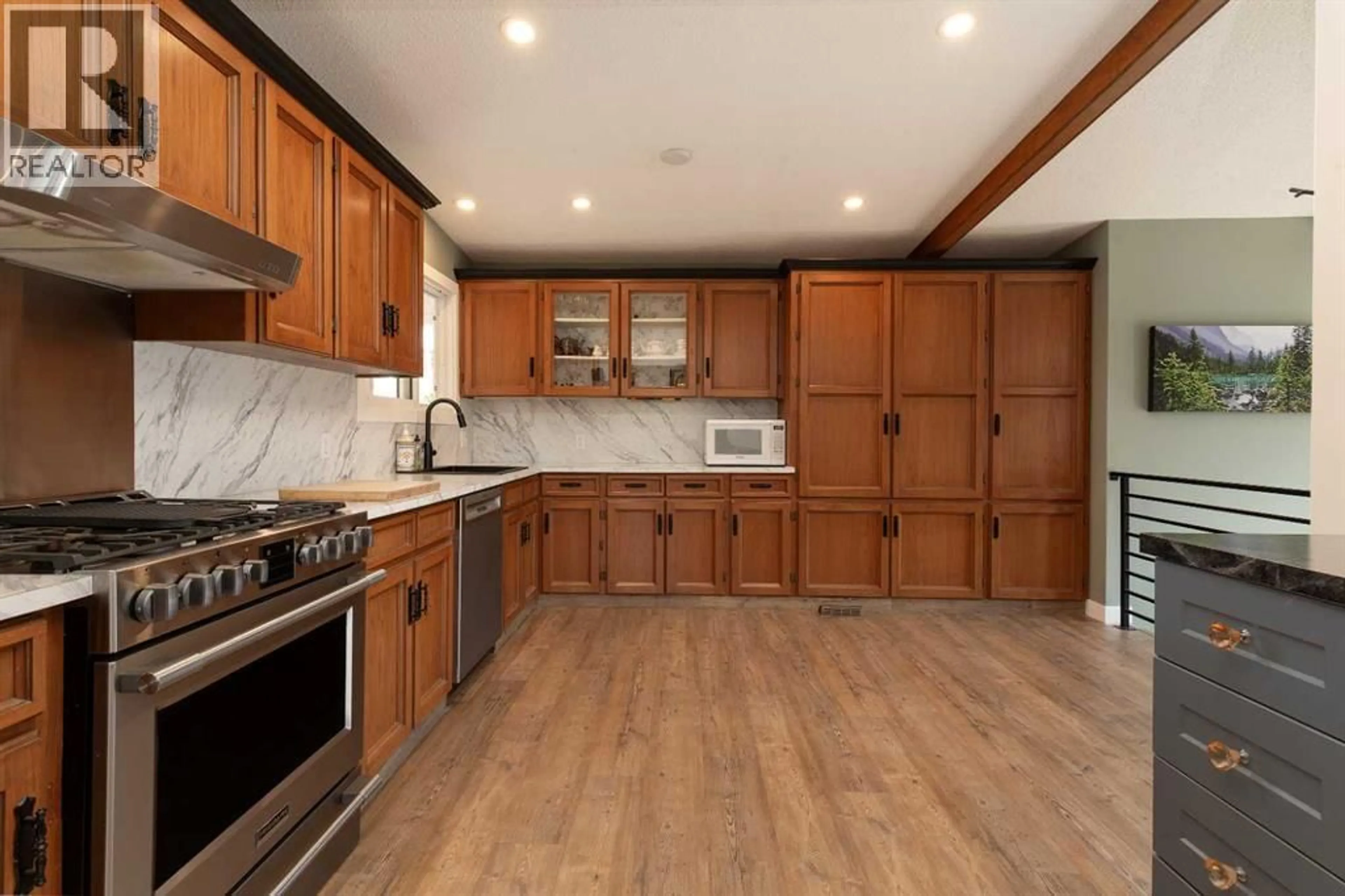 Open concept kitchen, wood/laminate floor for 321 NORMANDY ROAD SOUTH, Lethbridge Alberta T1J3X9