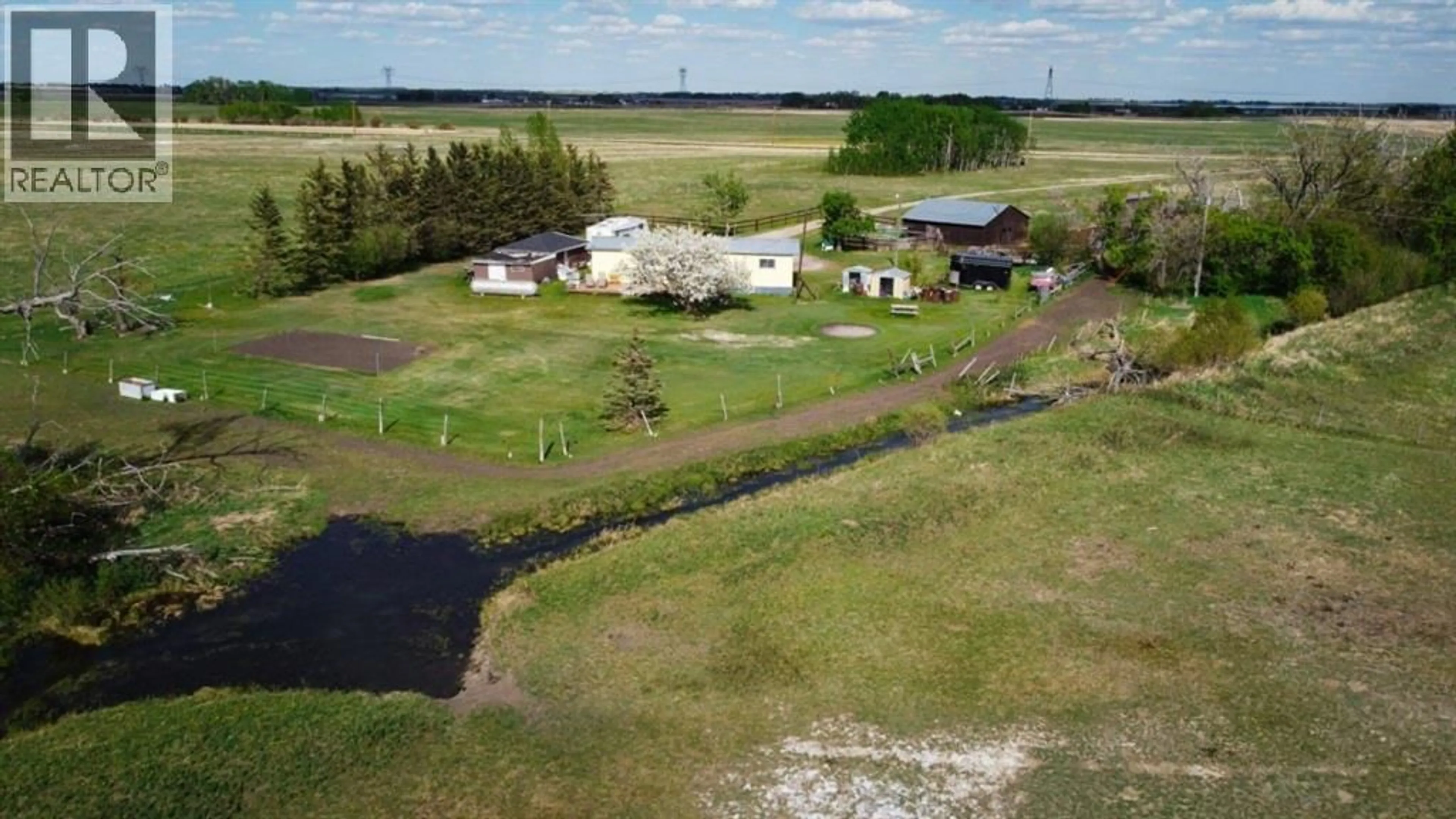 A pic from outside/outdoor area/front of a property/back of a property/a pic from drone, unknown for 240141 RANGE ROAD 274, Rural Rocky View County Alberta T1X2H9