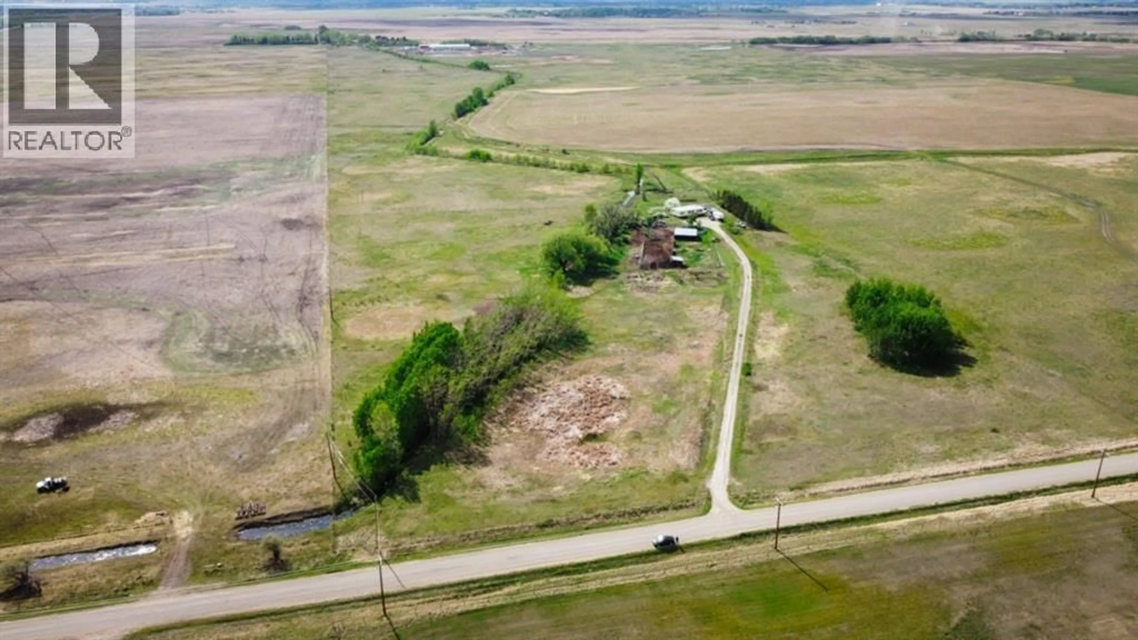 A pic from outside/outdoor area/front of a property/back of a property/a pic from drone, building for 240141 RANGE ROAD 274, Rural Rocky View County Alberta T1X2H9