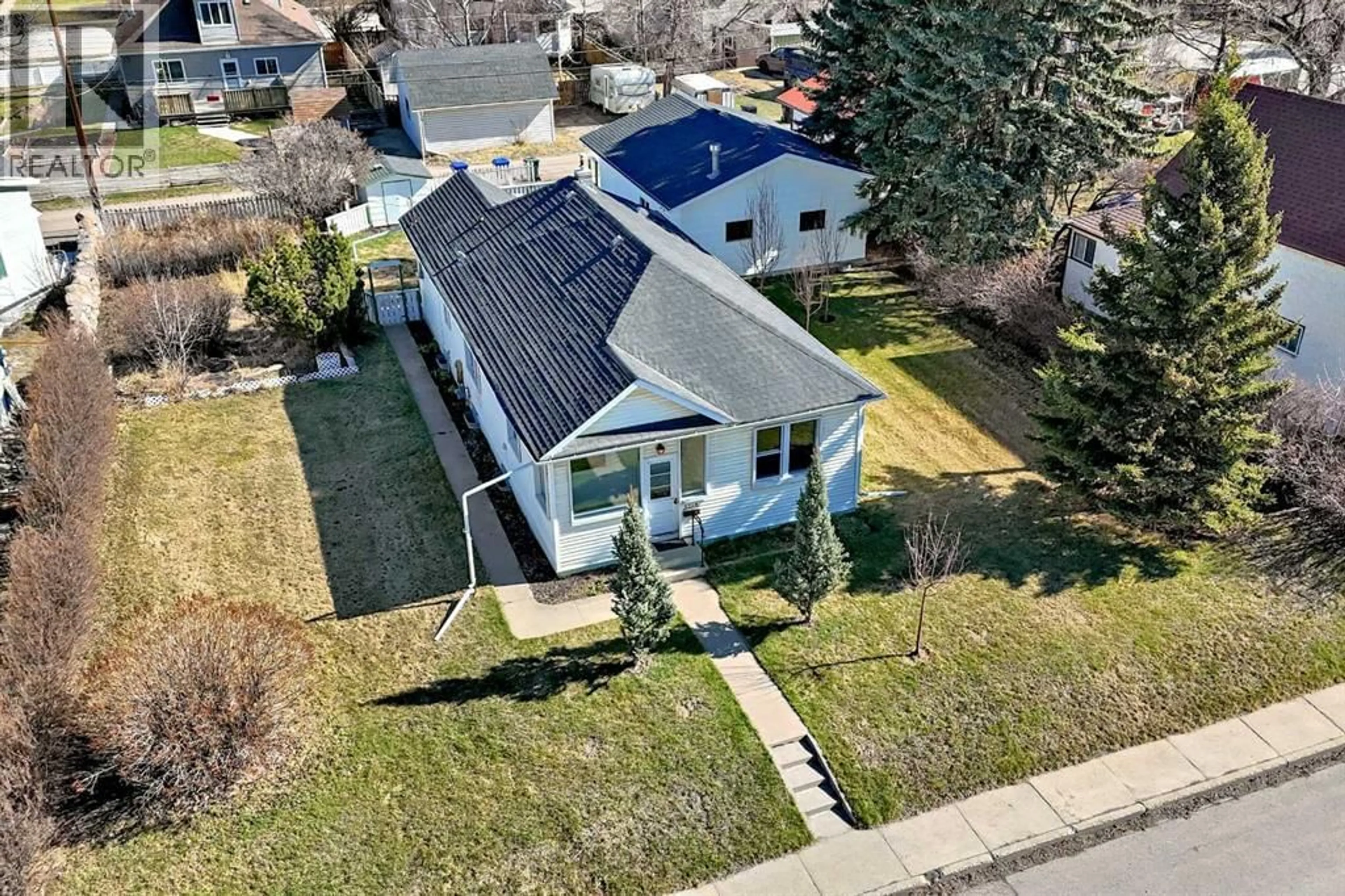 A pic from outside/outdoor area/front of a property/back of a property/a pic from drone, street for 4710 51 STREET, Olds Alberta T4H1E7