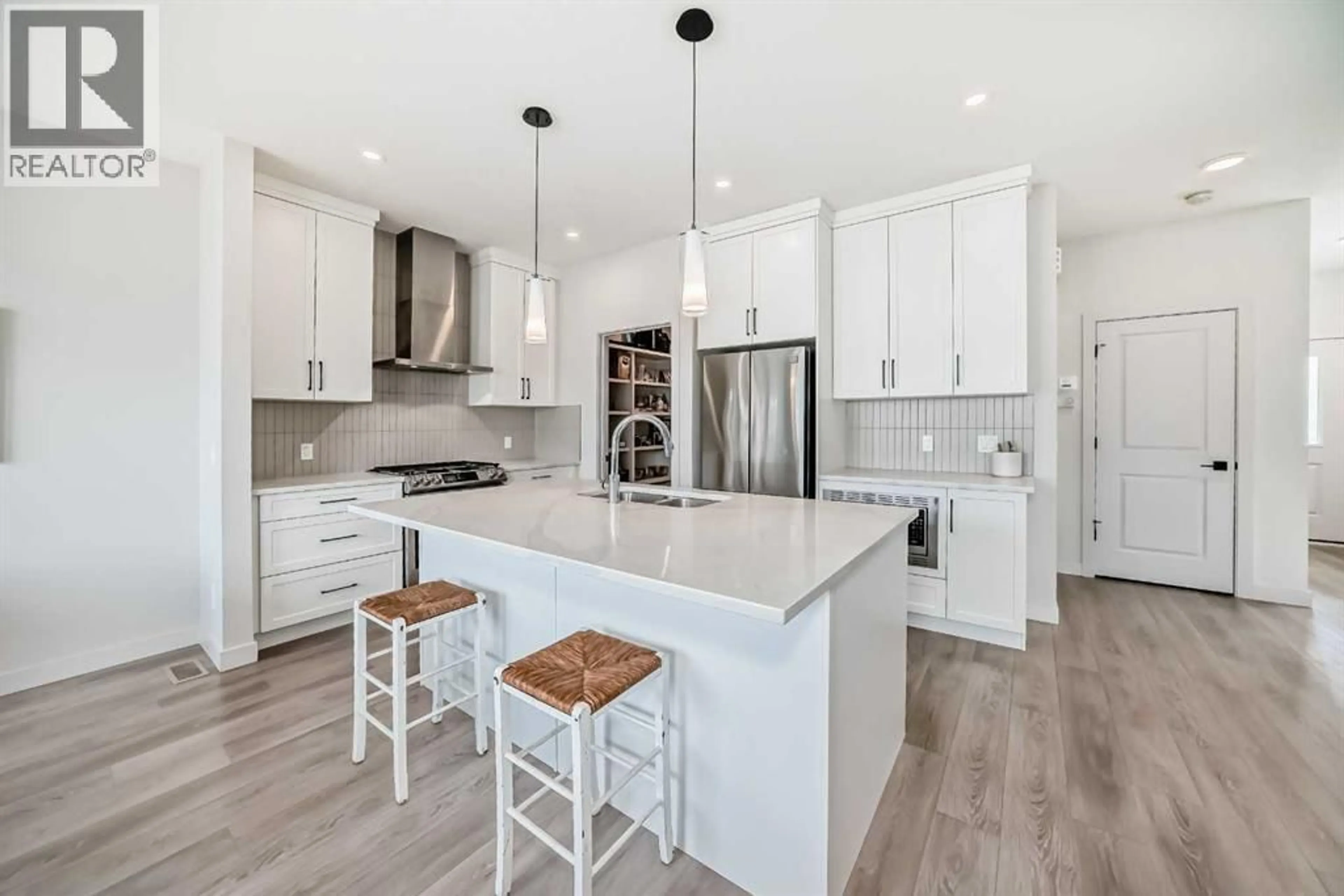 Open concept kitchen, unknown for 81 WILLOW COURT, Cochrane Alberta T4C2S7