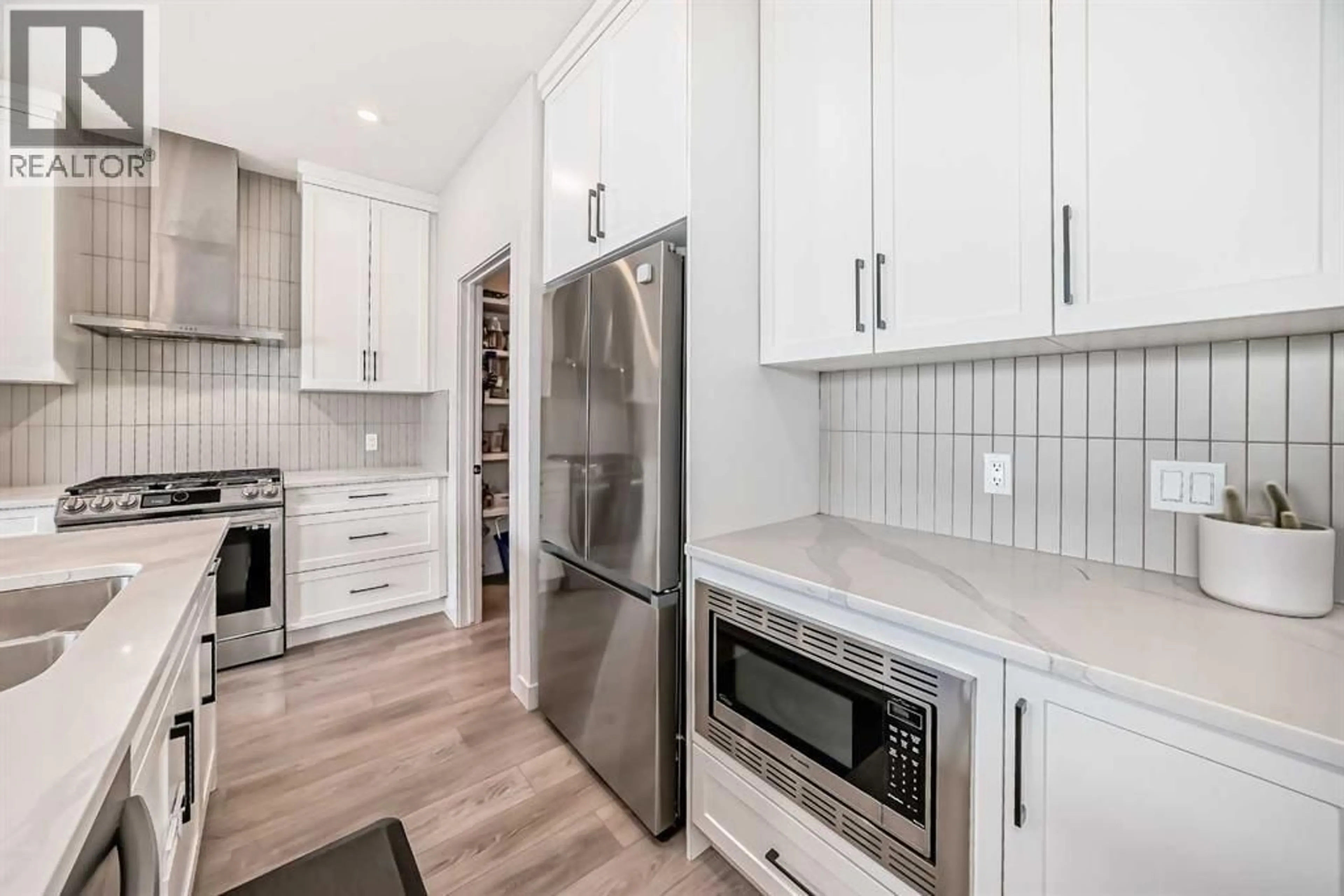 Open concept kitchen, ceramic/tile floor for 81 WILLOW COURT, Cochrane Alberta T4C2S7
