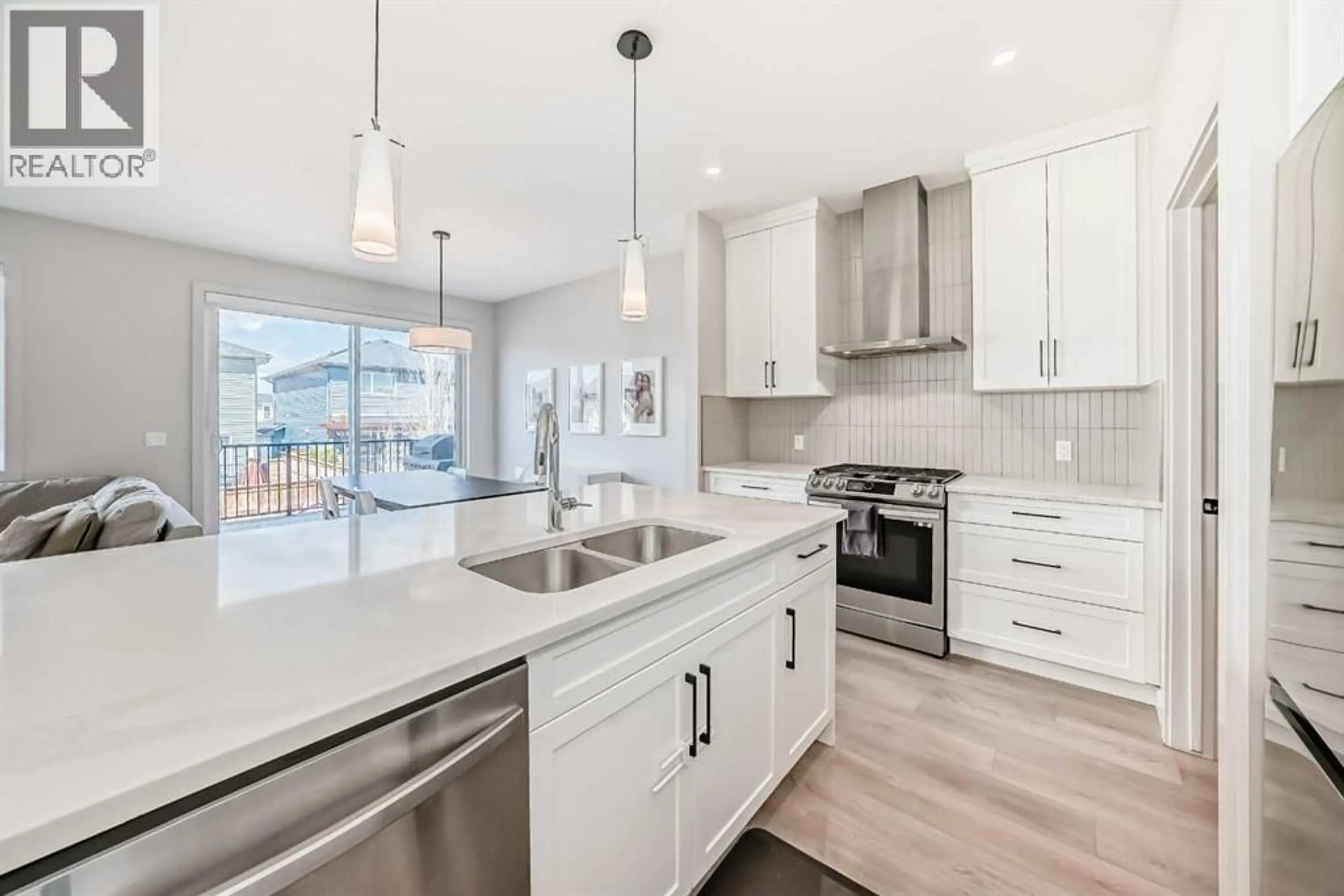 Open concept kitchen, ceramic/tile floor for 81 WILLOW COURT, Cochrane Alberta T4C2S7