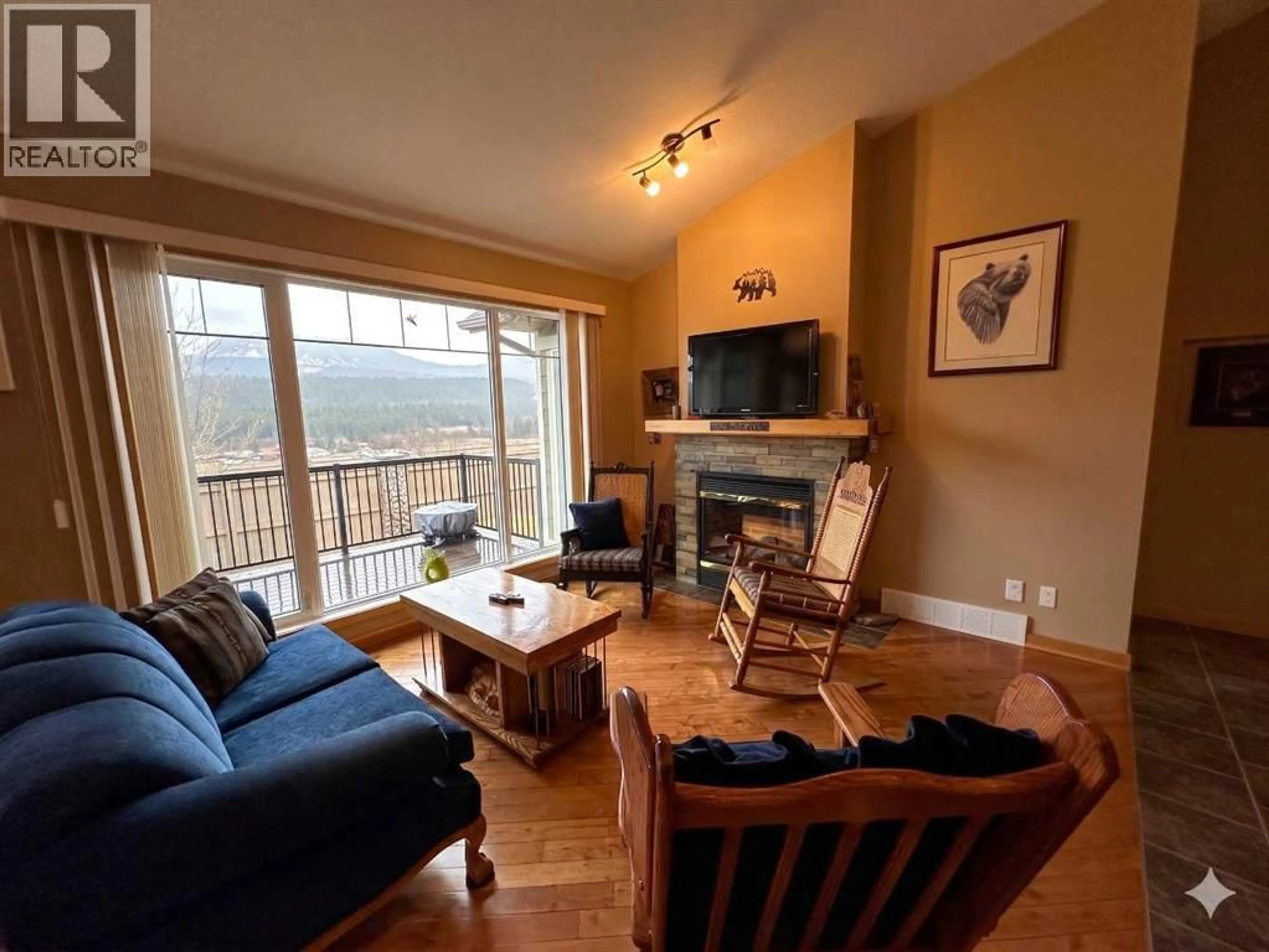 Living room with furniture, wood/laminate floor for 21 IRONSTONE DRIVE, Coleman Alberta T0K0M0