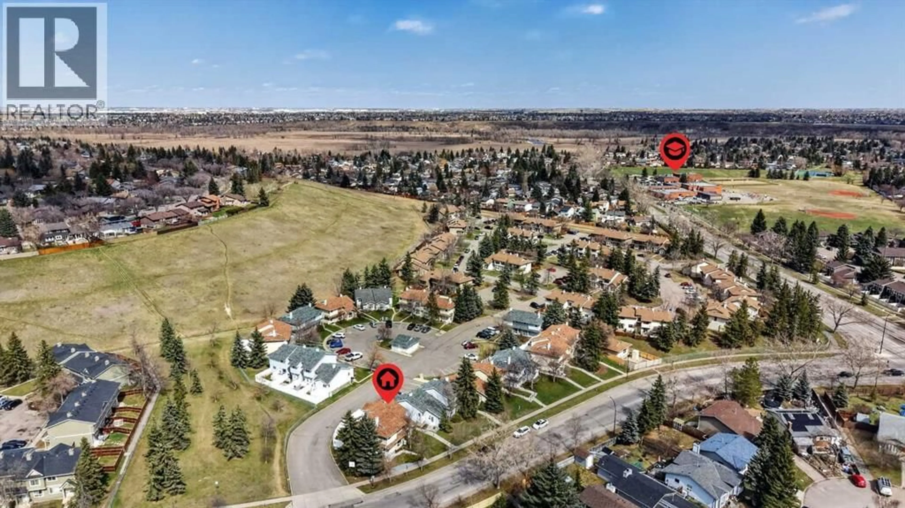 A pic from outside/outdoor area/front of a property/back of a property/a pic from drone, street for 171 DEERFIELD DRIVE SOUTHEAST, Calgary Alberta T2J7B7