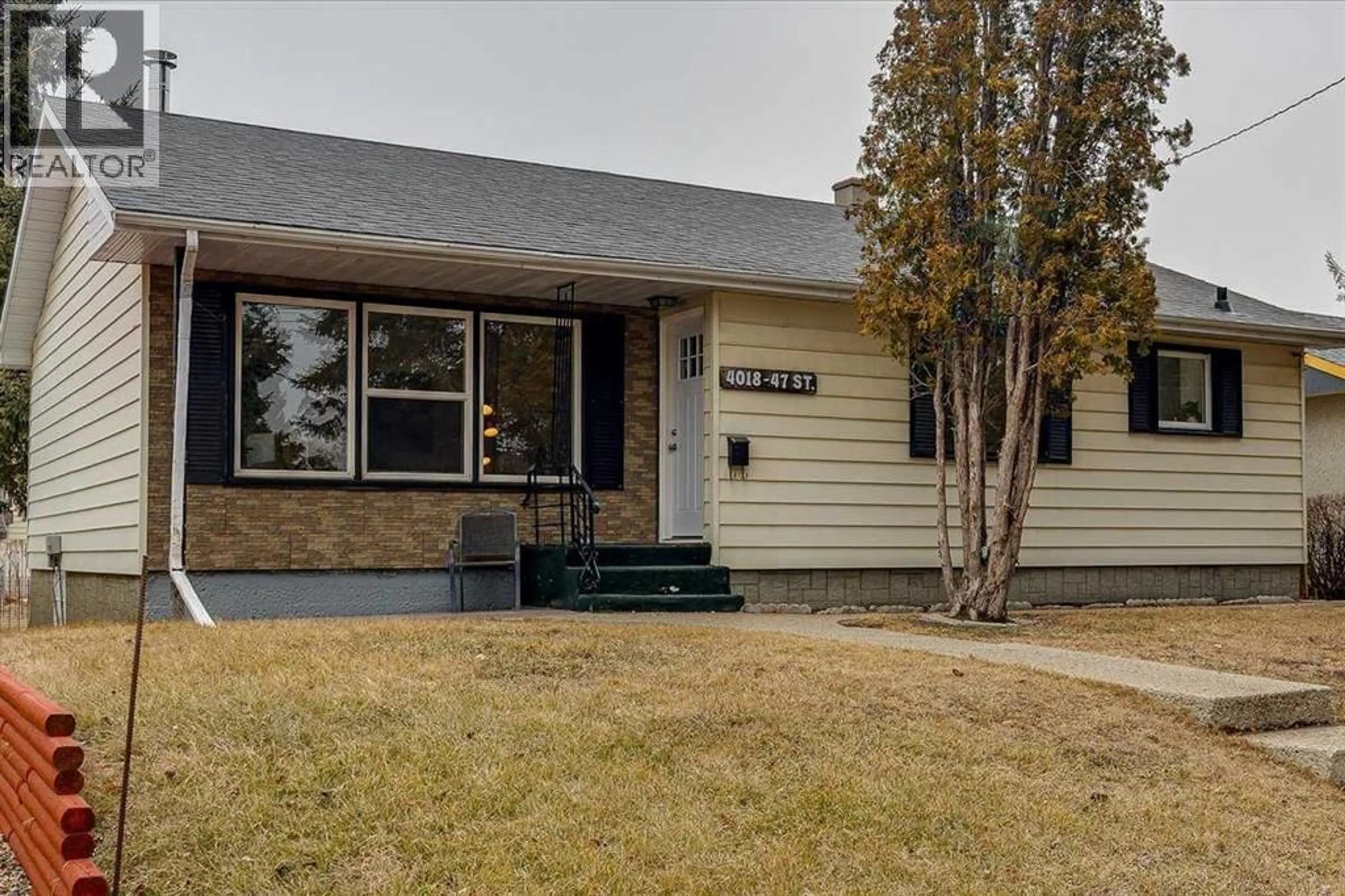 Home with vinyl exterior material, street for 4018 47 STREET, Red Deer Alberta T4N1P2
