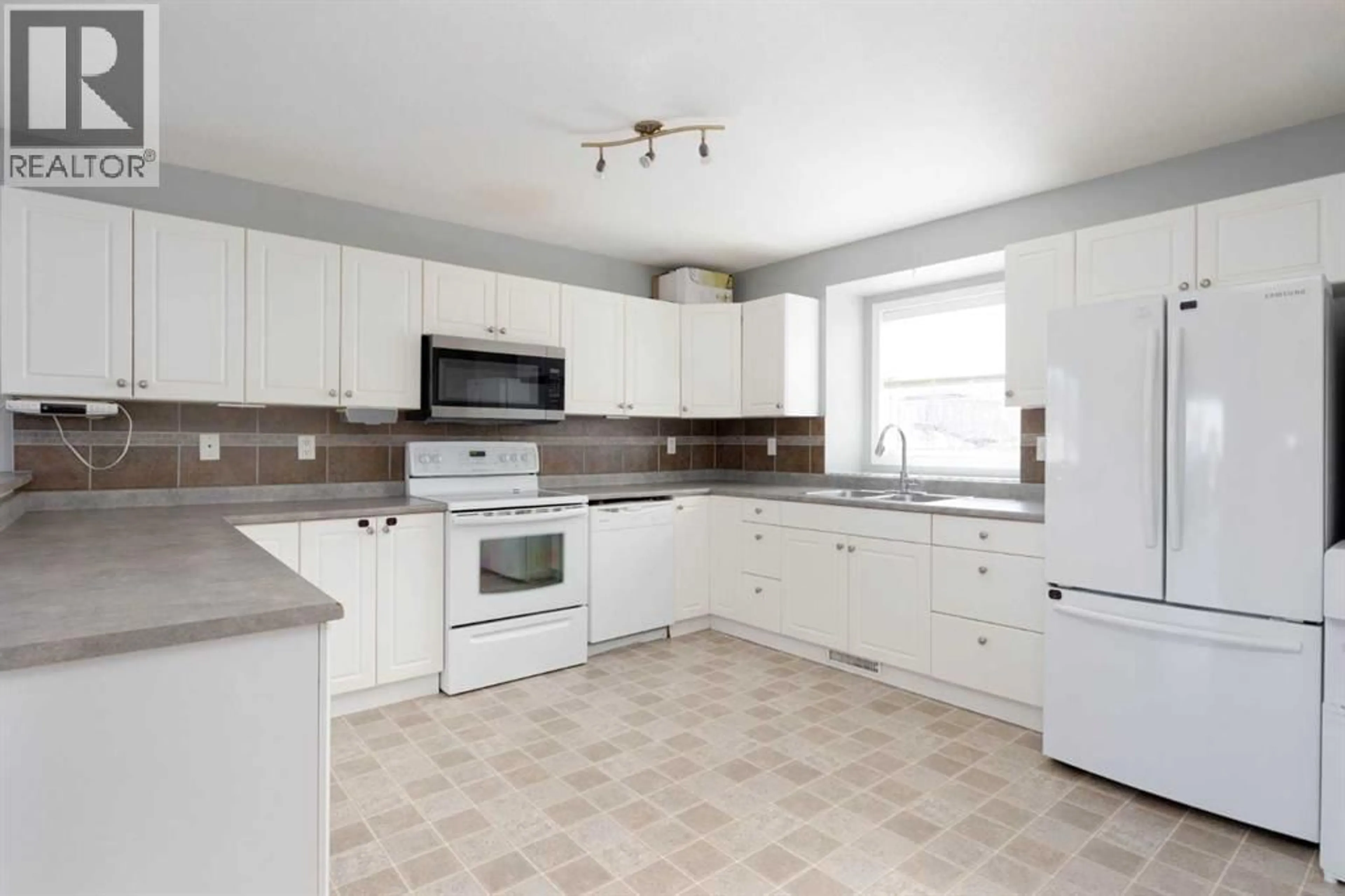 Open concept kitchen, ceramic/tile floor for 128 PARRY CRESCENT, Fort McMurray Alberta T9K0A4