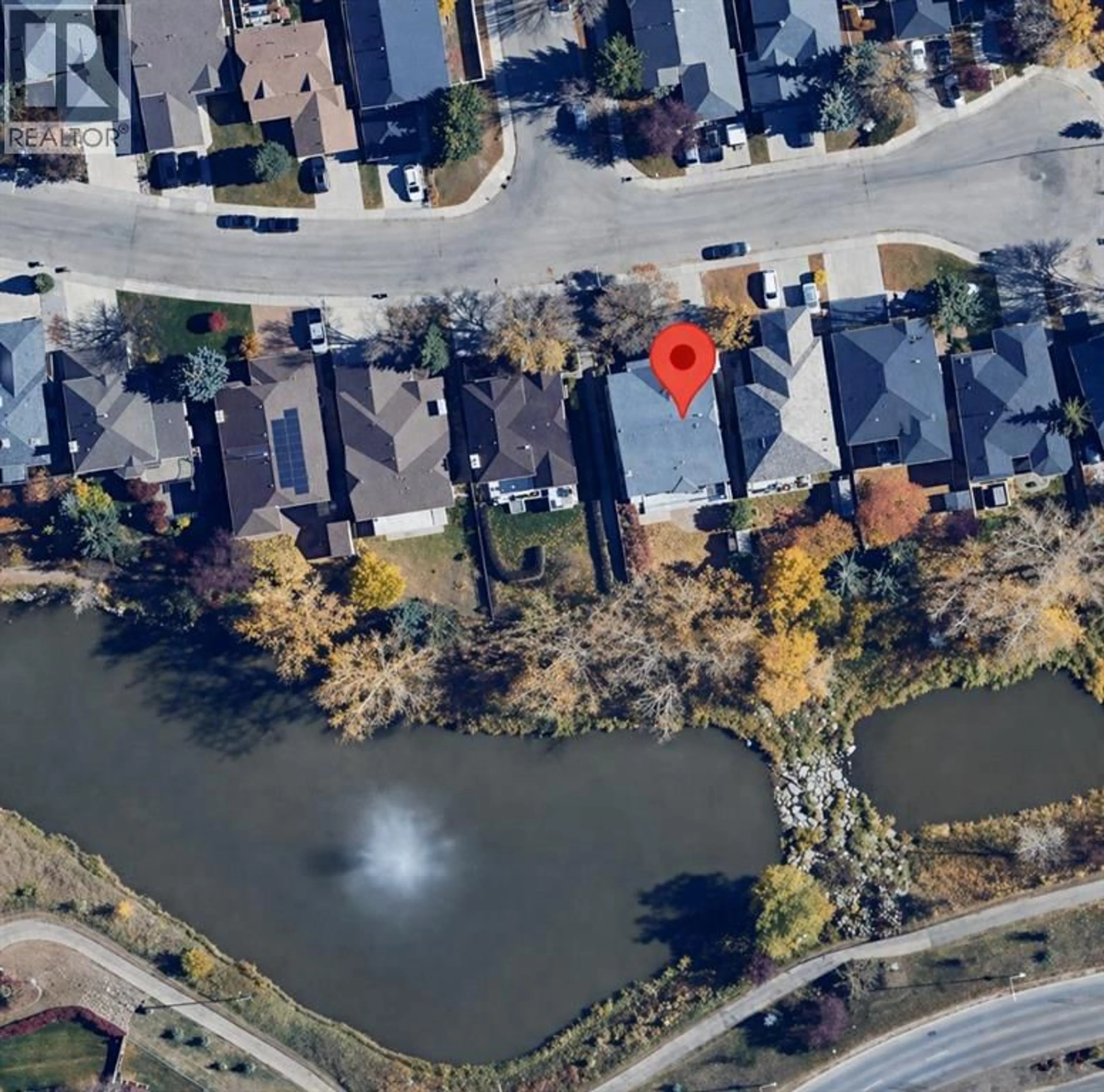 A pic from outside/outdoor area/front of a property/back of a property/a pic from drone, water/lake/river/ocean view for 152 WATERSTONE PLACE SOUTHEAST, Airdrie Alberta T4B2G1