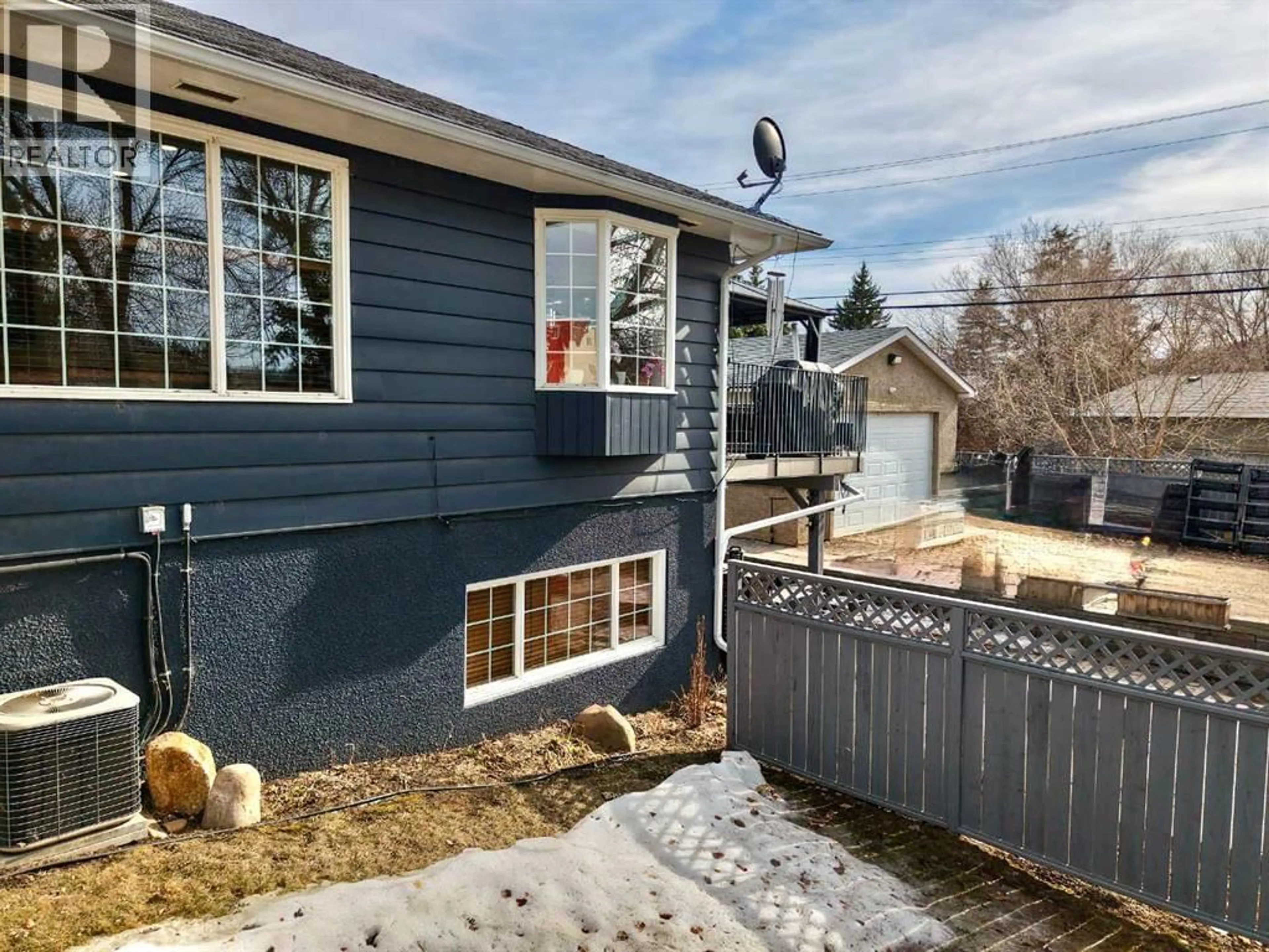 A pic from outside/outdoor area/front of a property/back of a property/a pic from drone, street for 10702 101 STREET, Peace River Alberta T8S1L1