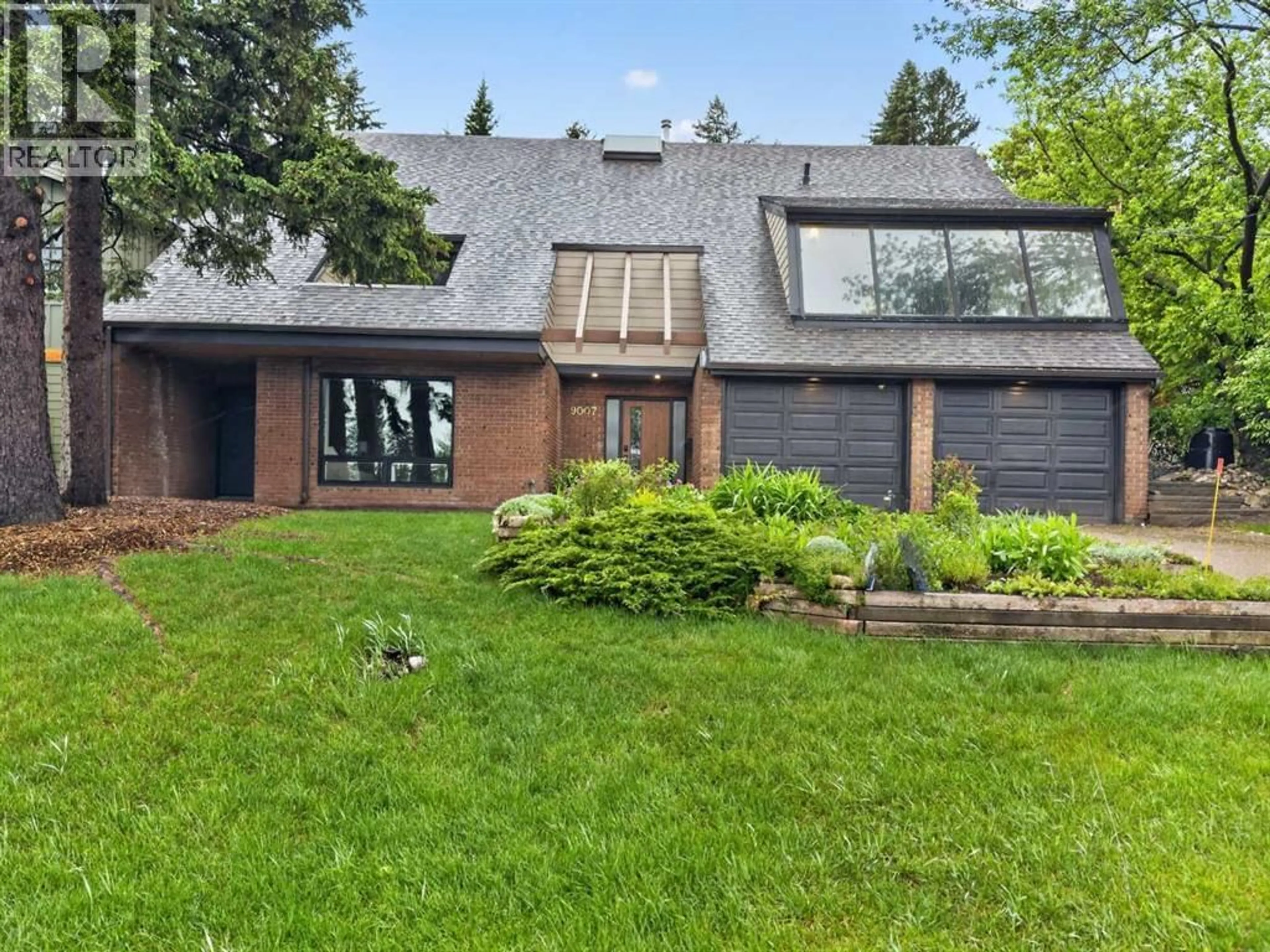 Home with brick exterior material, street for 9007 33 AVENUE NORTHWEST, Calgary Alberta T3B1M2