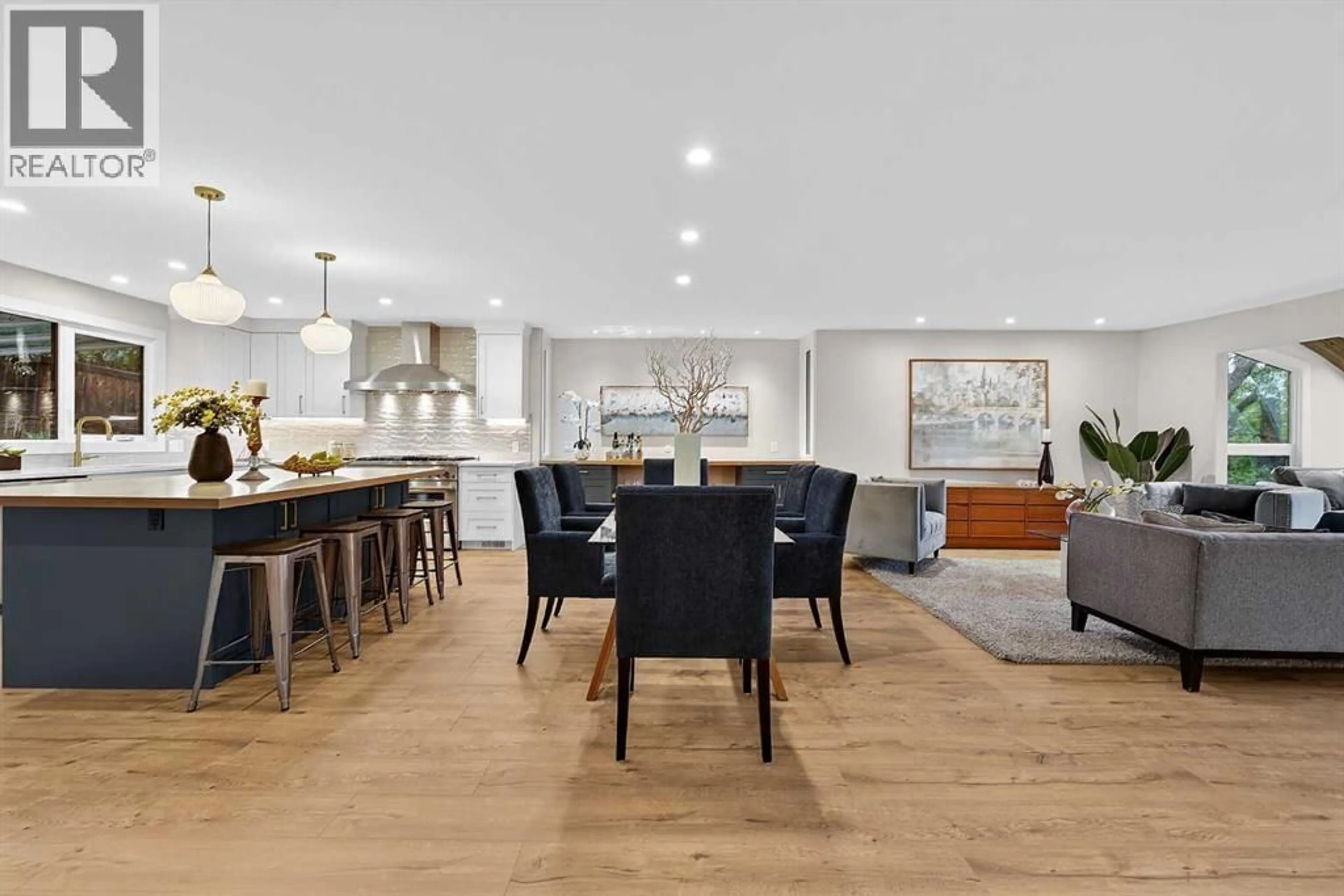 Open concept kitchen, wood/laminate floor for 9007 33 AVENUE NORTHWEST, Calgary Alberta T3B1M2
